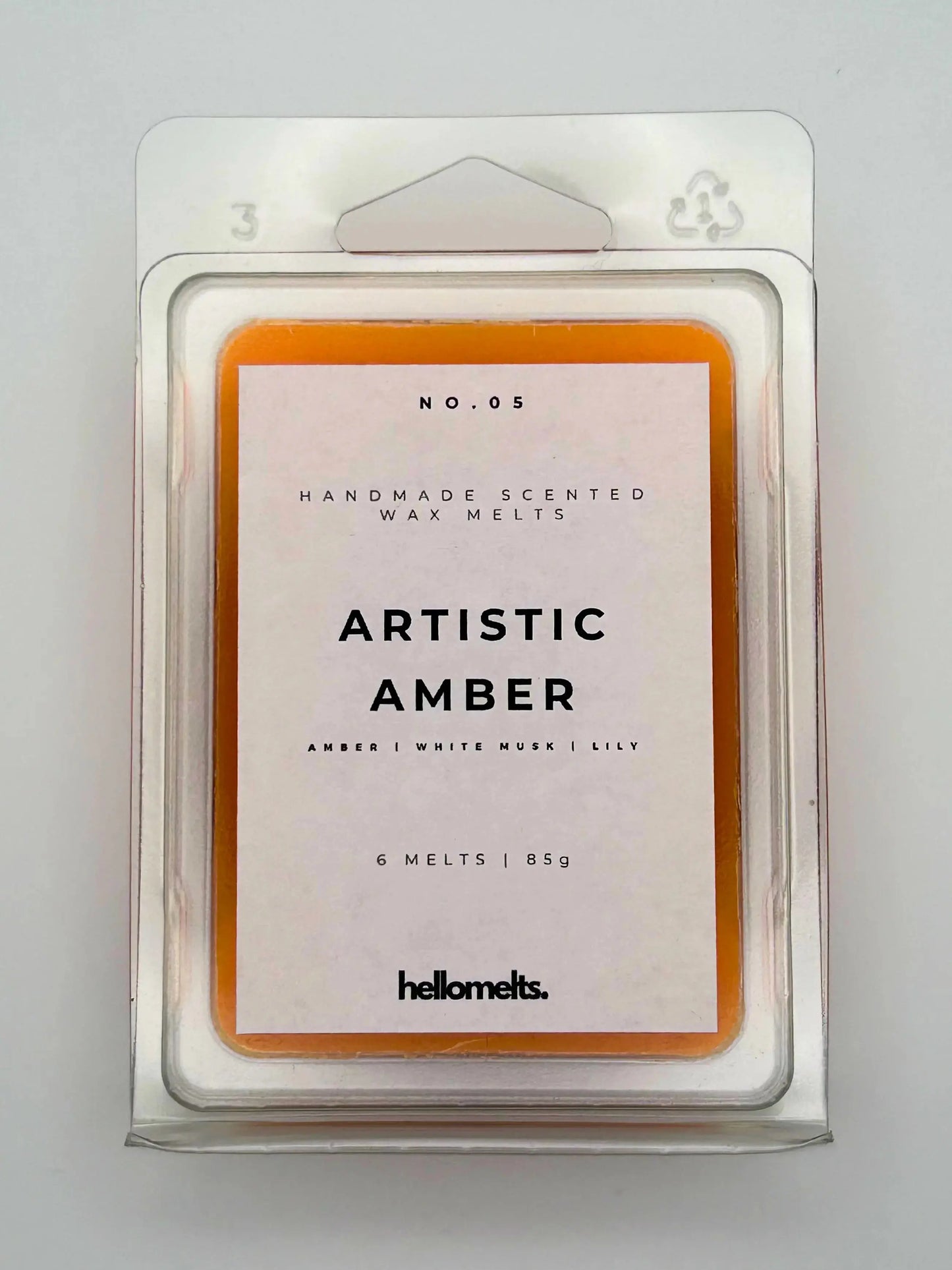 Artistic Amber 85g wax melt pack, front view, by Hellomelts, infused with notes of amber, white musk, and lily, ready to fragrance your home.