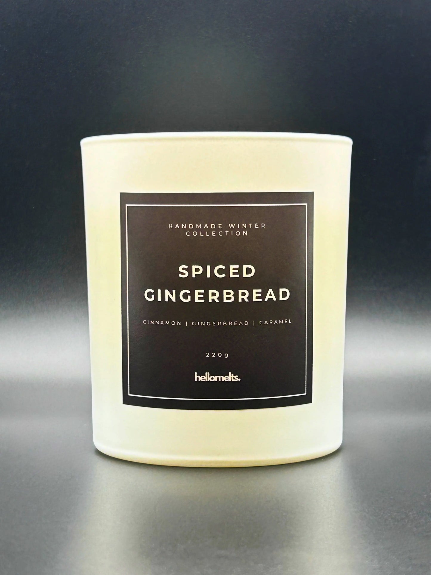 Spiced Gingerbread 220g, with no lid, candle by Hellomelts, rich with scents of cinnamon, gingerbread, and caramel, presented in a white matt jar with wooden lid.