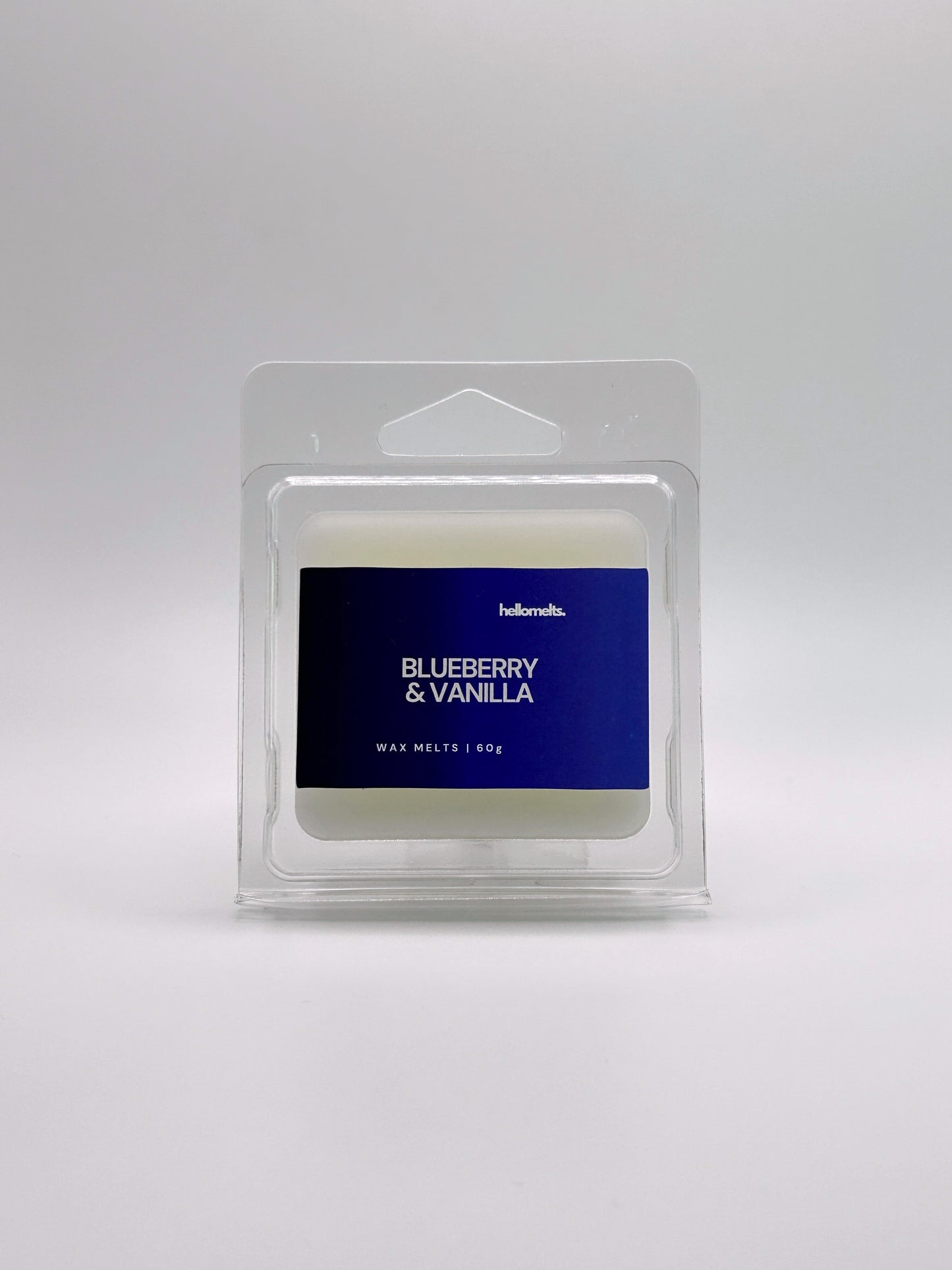 Front-facing view of Hellomelts Blueberry & Vanilla 60g wax melt bar from the Summer Collection, with bold blue label and clamshell packaging