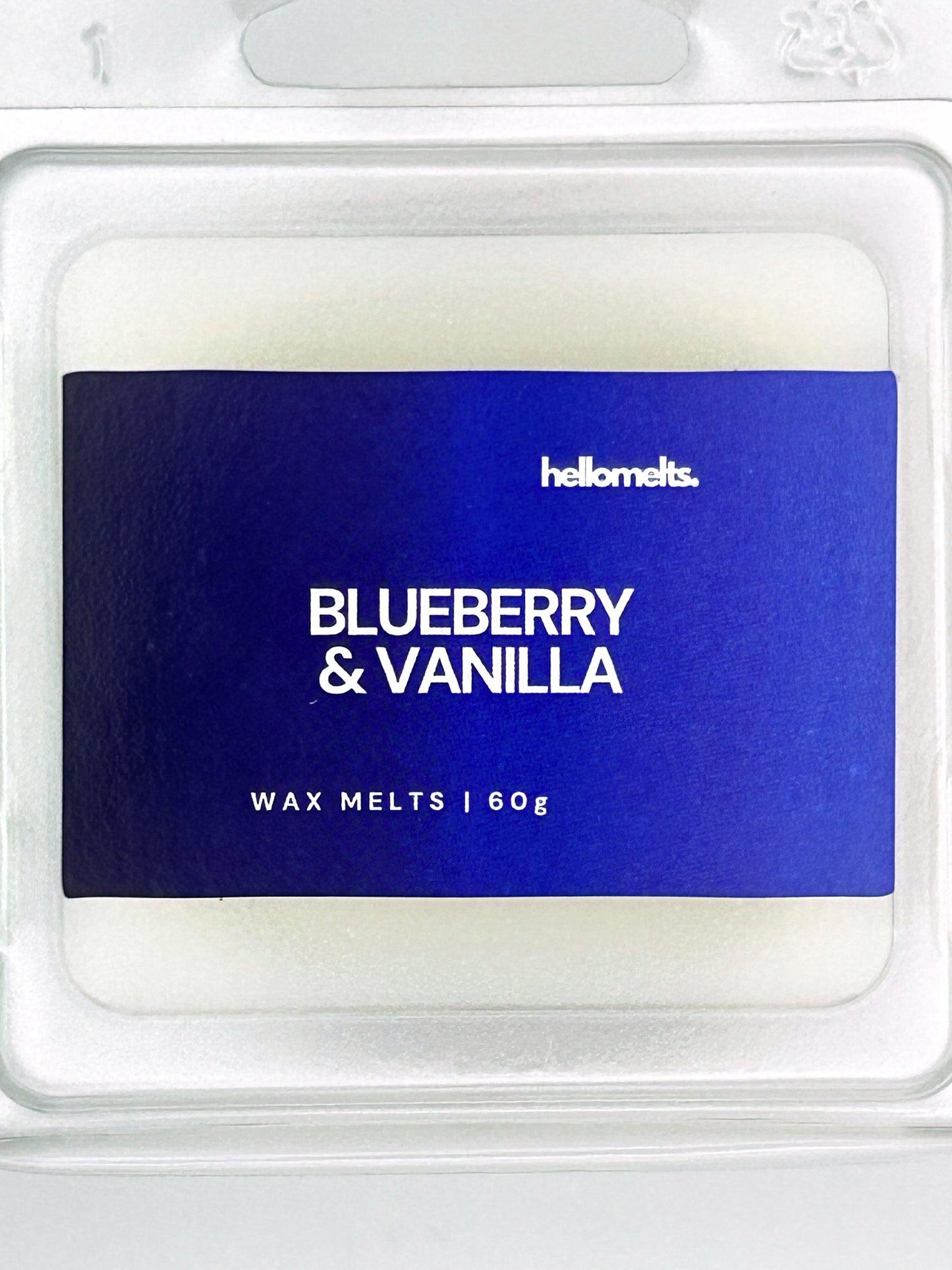 Close-up of the Blueberry & Vanilla 60g wax melt label, showing detailed Hellomelts branding and berry-sweet scent design