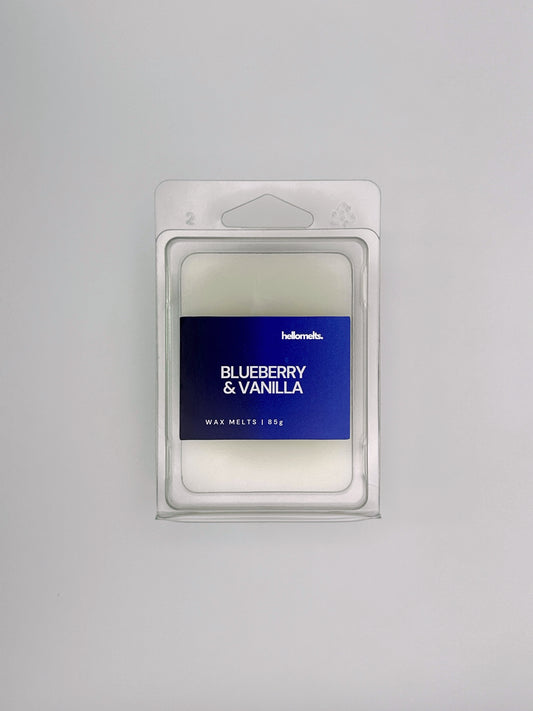 Flatlay of Blueberry & Vanilla 85g wax melt bar by Hellomelts, part of the Summer Collection with deep blue hues and fresh design