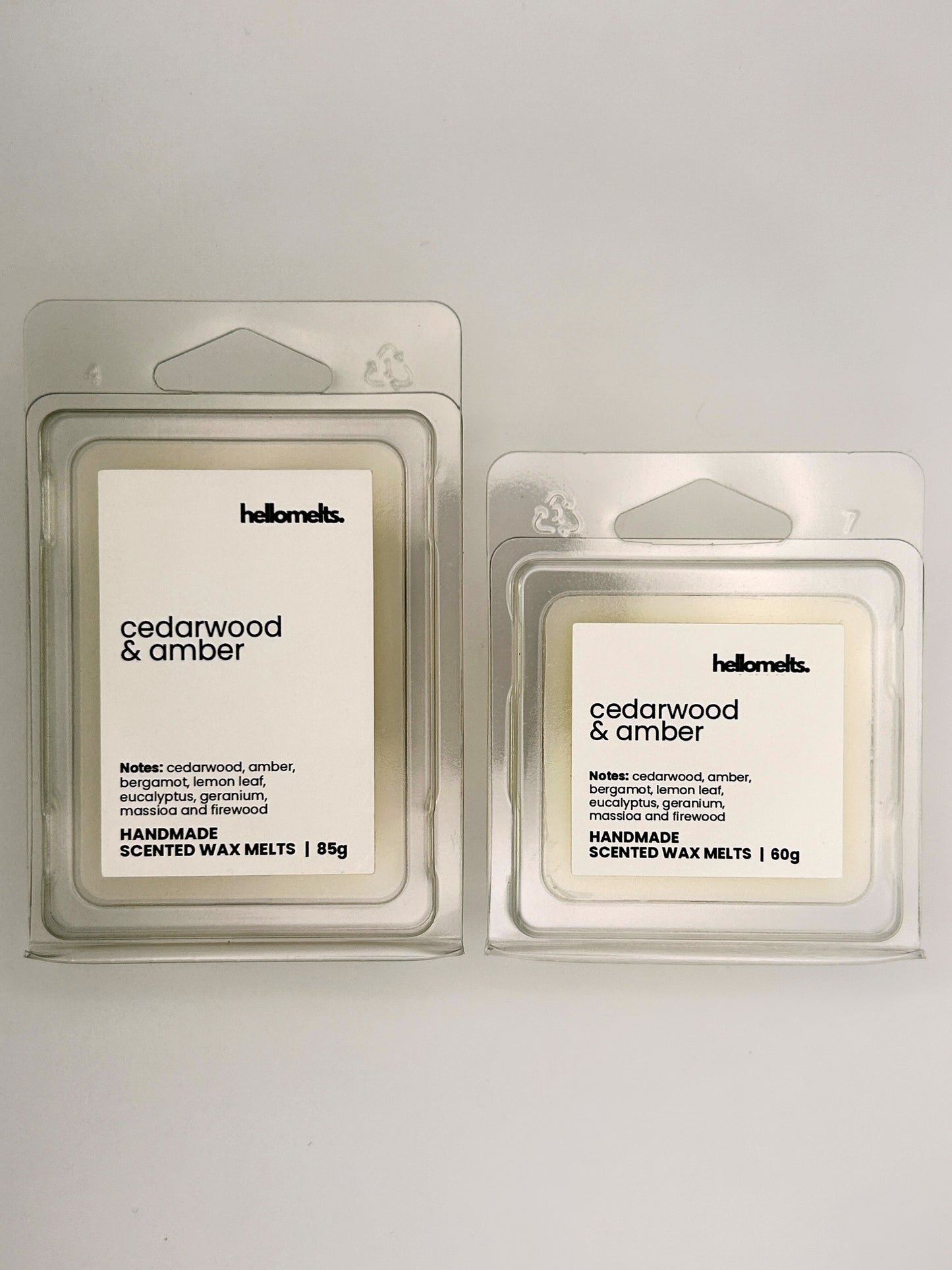Cedarwood & Amber wax melts in 60g and 85g clamshells shown side by side from the Hellomelts Autumn Collection