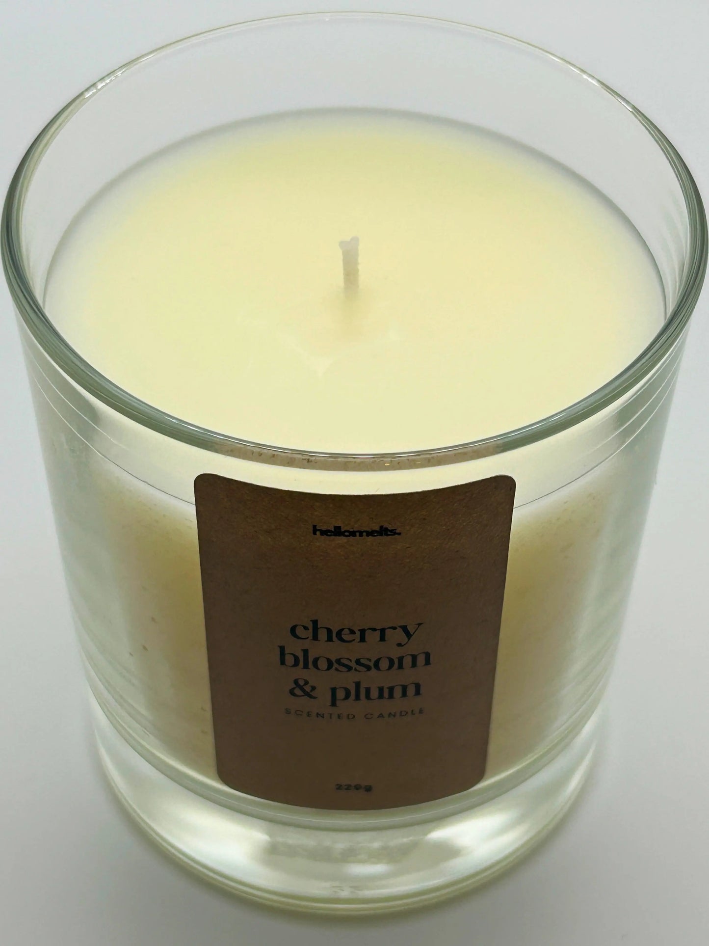 Close-up detail of the Cherry Blossom & Plum candle wax and wick, highlighting the off-white wax used in Hellomelts' Spring Collection.