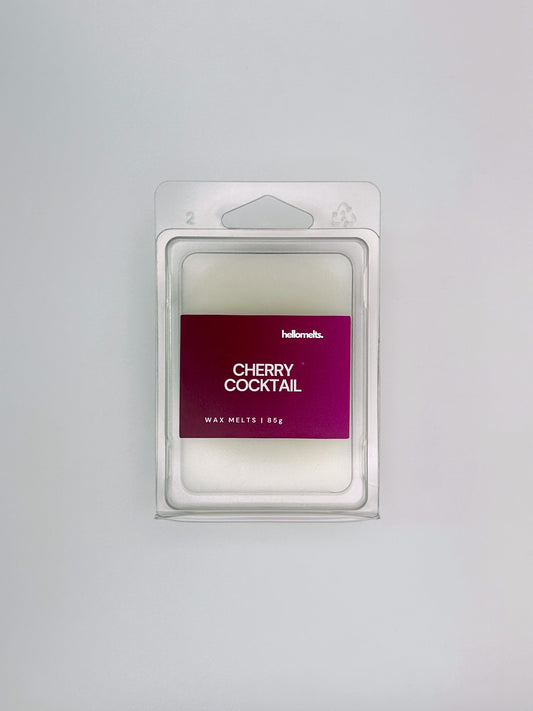 Flatlay of Cherry Cocktail 85g wax melt bar by Hellomelts, part of the Summer Collection with vibrant colours and fruity cocktail theme