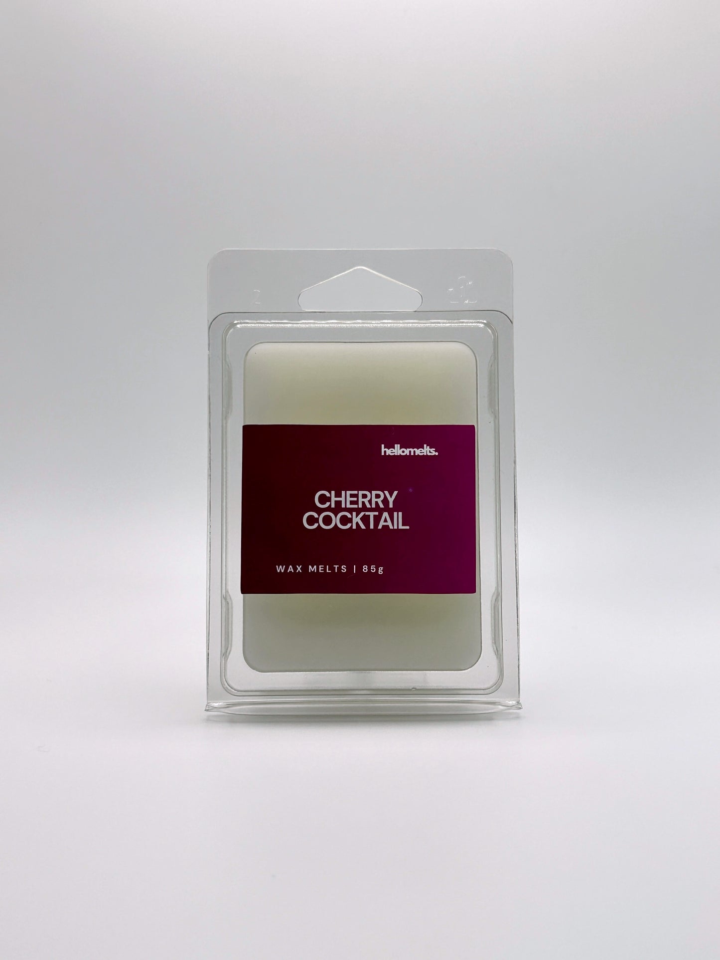 Front-facing view of Hellomelts Cherry Cocktail 85g wax melt bar from the Summer Collection, featuring bold red label and clamshell packaging