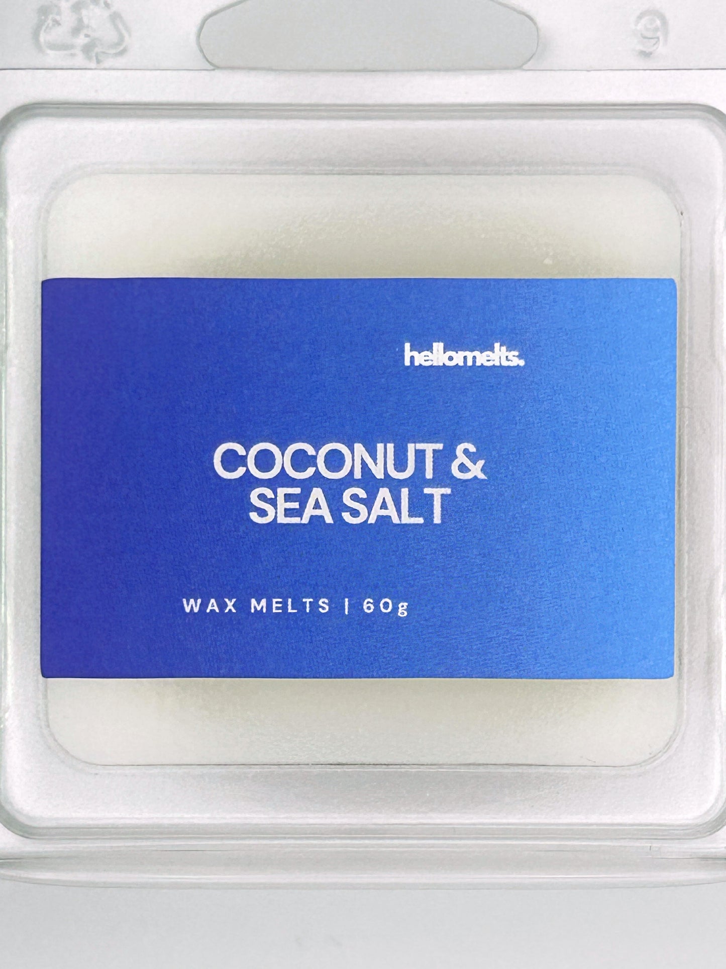 Close-up of the Coconut & Sea Salt 60g wax melt label, showing detailed branding and seaside fragrance design from Hellomelts