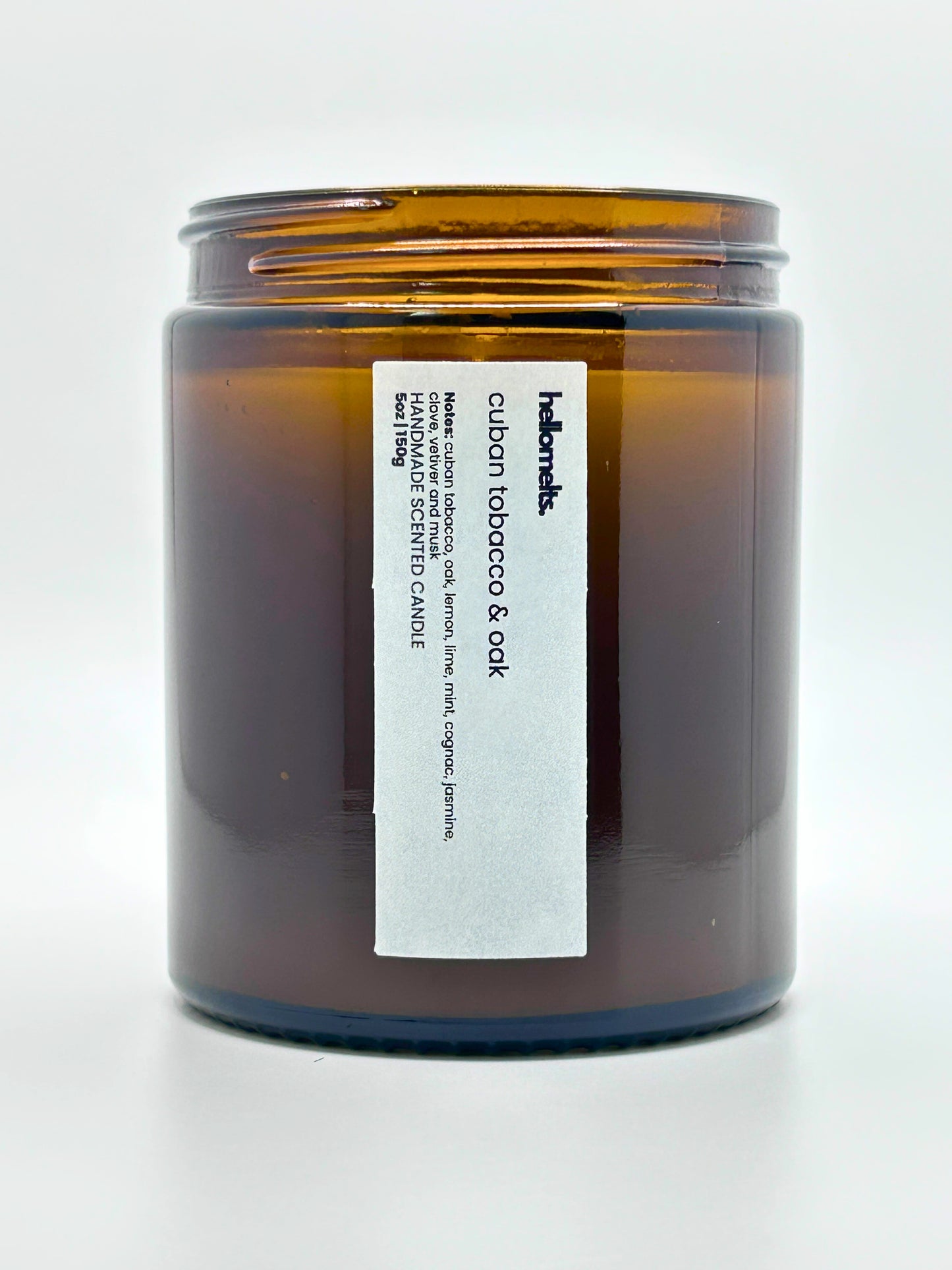 Close-up front view of Cuban Tobacco & Oak autumn scented candle by Hellomelts with the lid off, part of the Autumn Collection