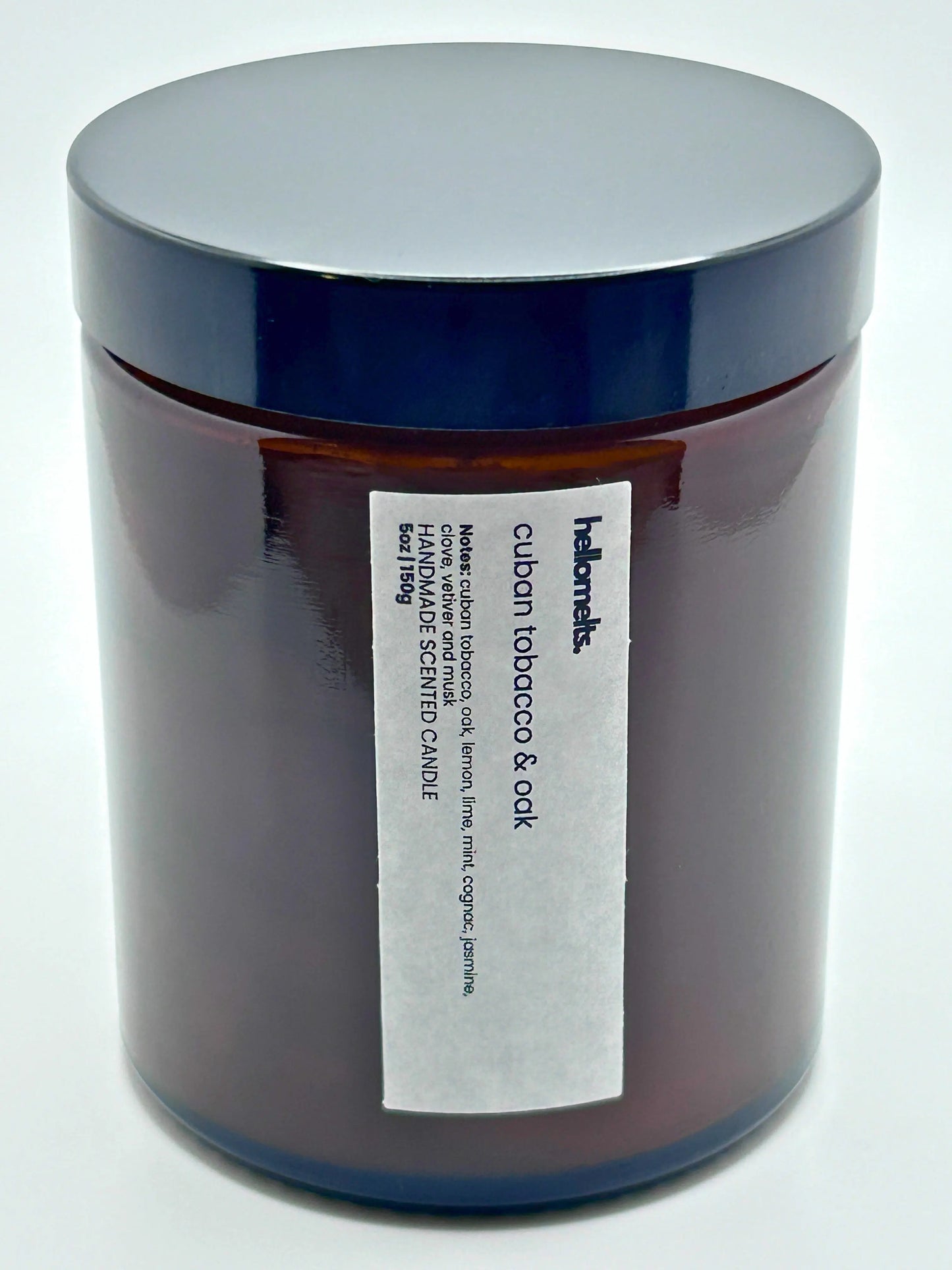 Close-up front view of Cuban Tobacco & Oak candle by Hellomelts with the lid on, part of the autumn collection.