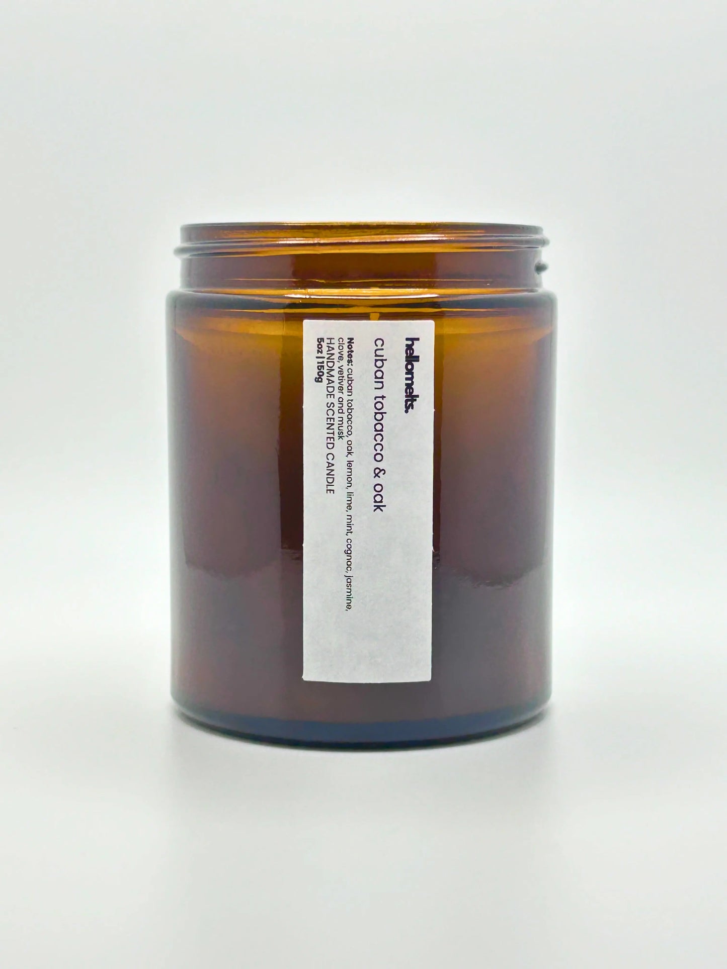Front view of Cuban Tobacco & Oak candle by Hellomelts with the lid off, showing the hand-poured wax, from the autumn collection.