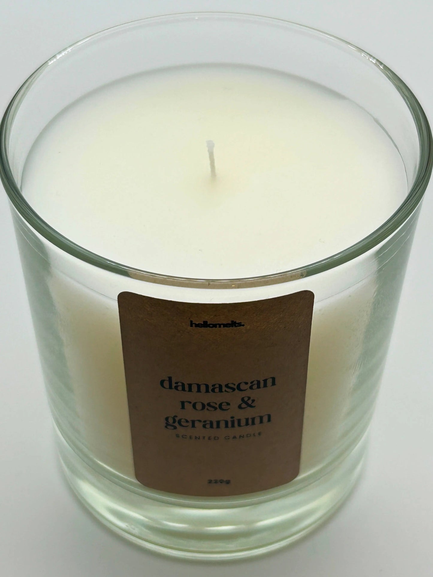 Close-up detail of the Damascan Rose & Geranium candle wax and wick, highlighting the clean white wax used in Hellomelts' Spring Collection.