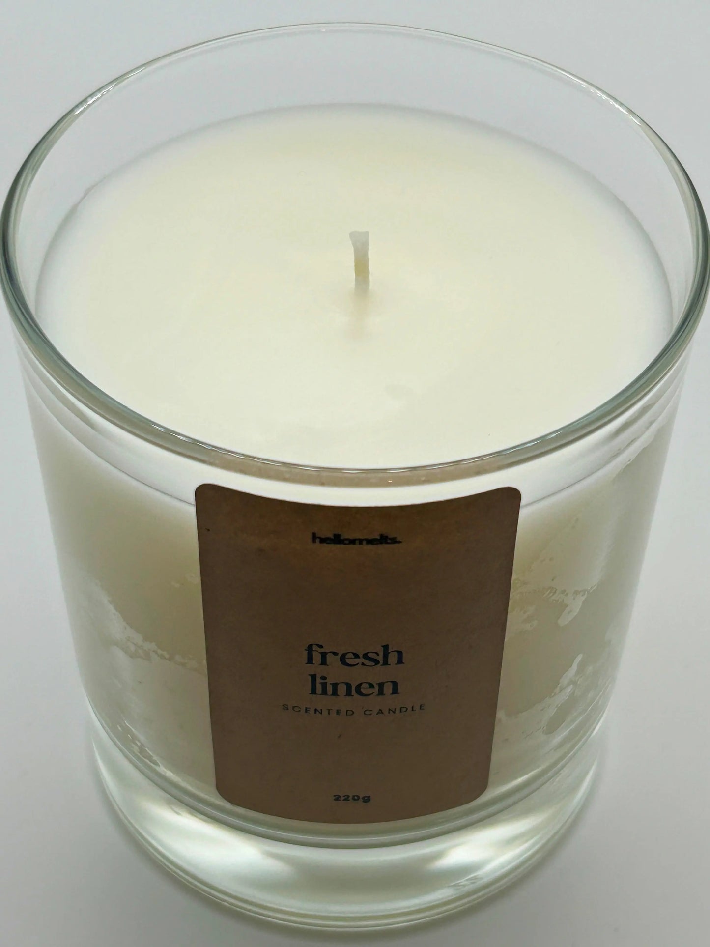 Close-up detail of the Fresh Linen candle wax and wick, highlighting the clean white wax used in Hellomelts' Spring Collection.