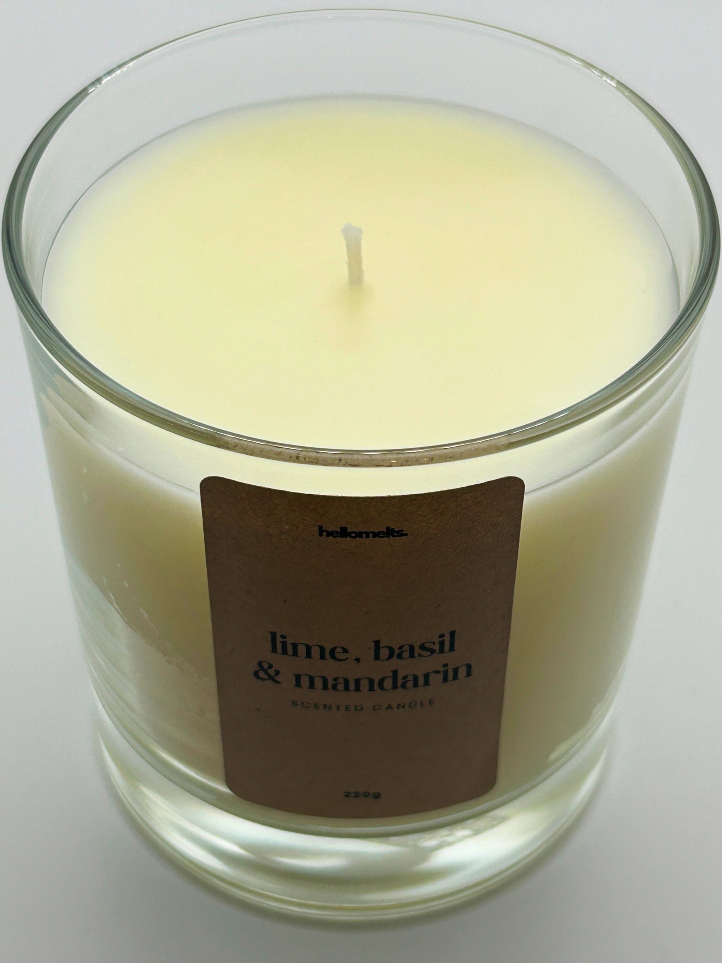 Close-up detail of the Lime, Basil & Mandarin candle wax and wick, highlighting the clean off-white wax used in Hellomelts' Spring Collection.