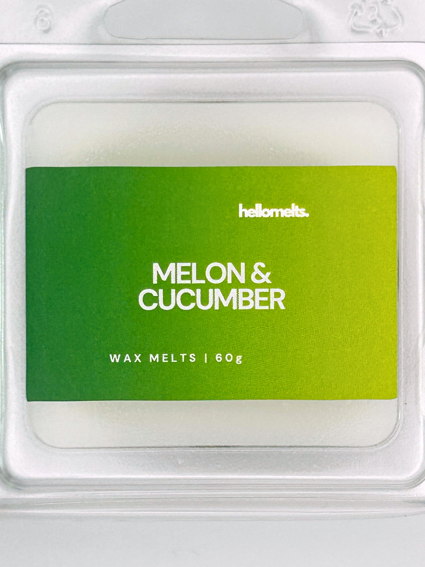 Close-up of the Melon & Cucumber 60g wax melt label, showing detailed Hellomelts branding and summer scent design