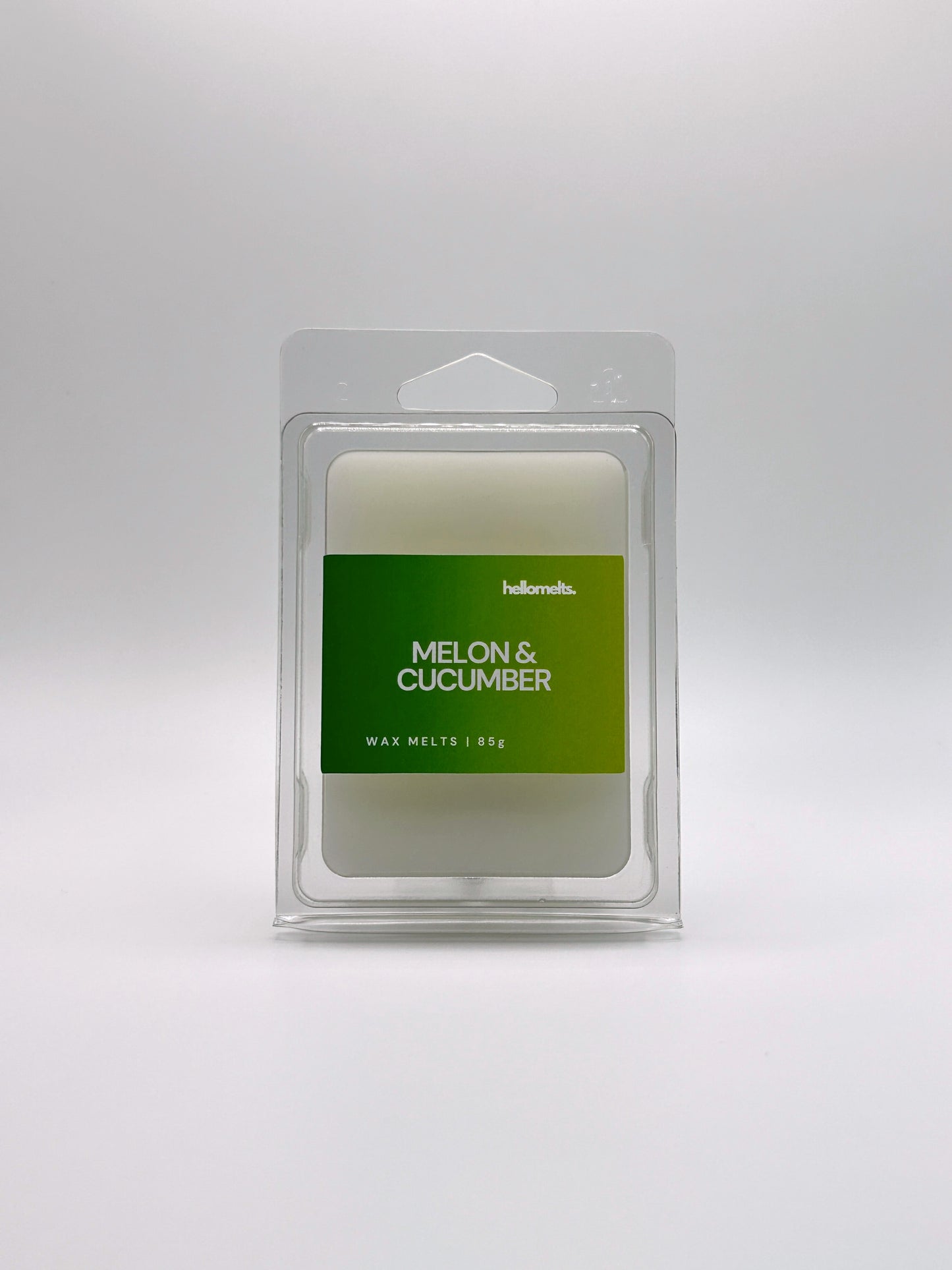 Front-facing view of Hellomelts Melon & Cucumber 85g wax melt bar from the Summer Collection, featuring bold green label and clamshell packaging