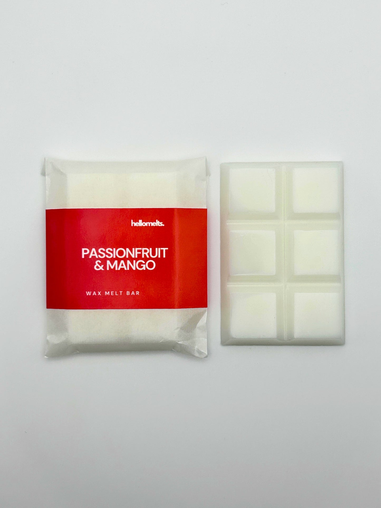 Passionfruit & Mango 30g wax melt bar by Hellomelts, shown unwrapped beside the six-bar segmented wax melt.
