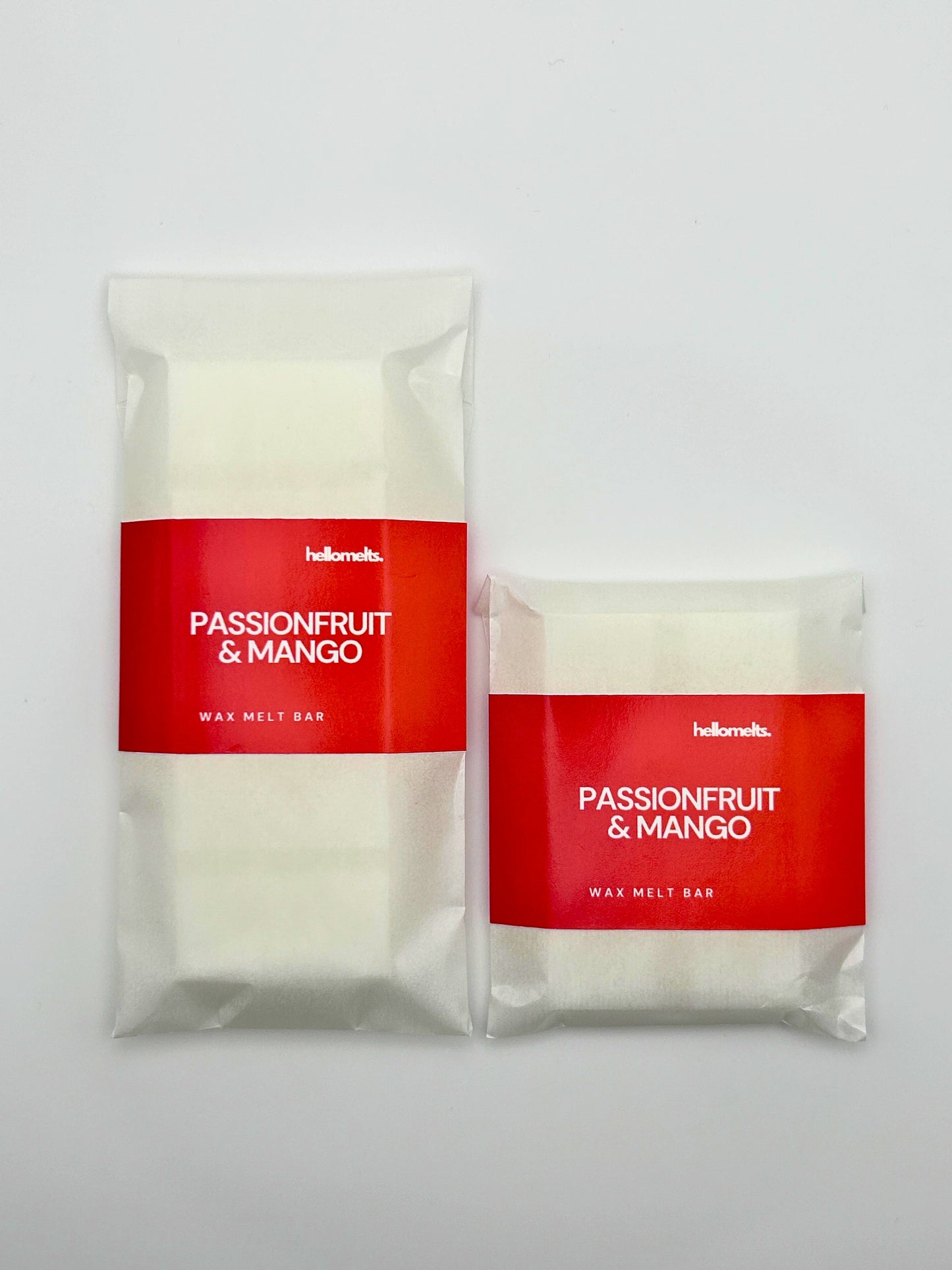 Side-by-side size comparison of Hellomelts Passionfruit & Mango wax melts in 30g and 50g bar formats from the Summer Collection.