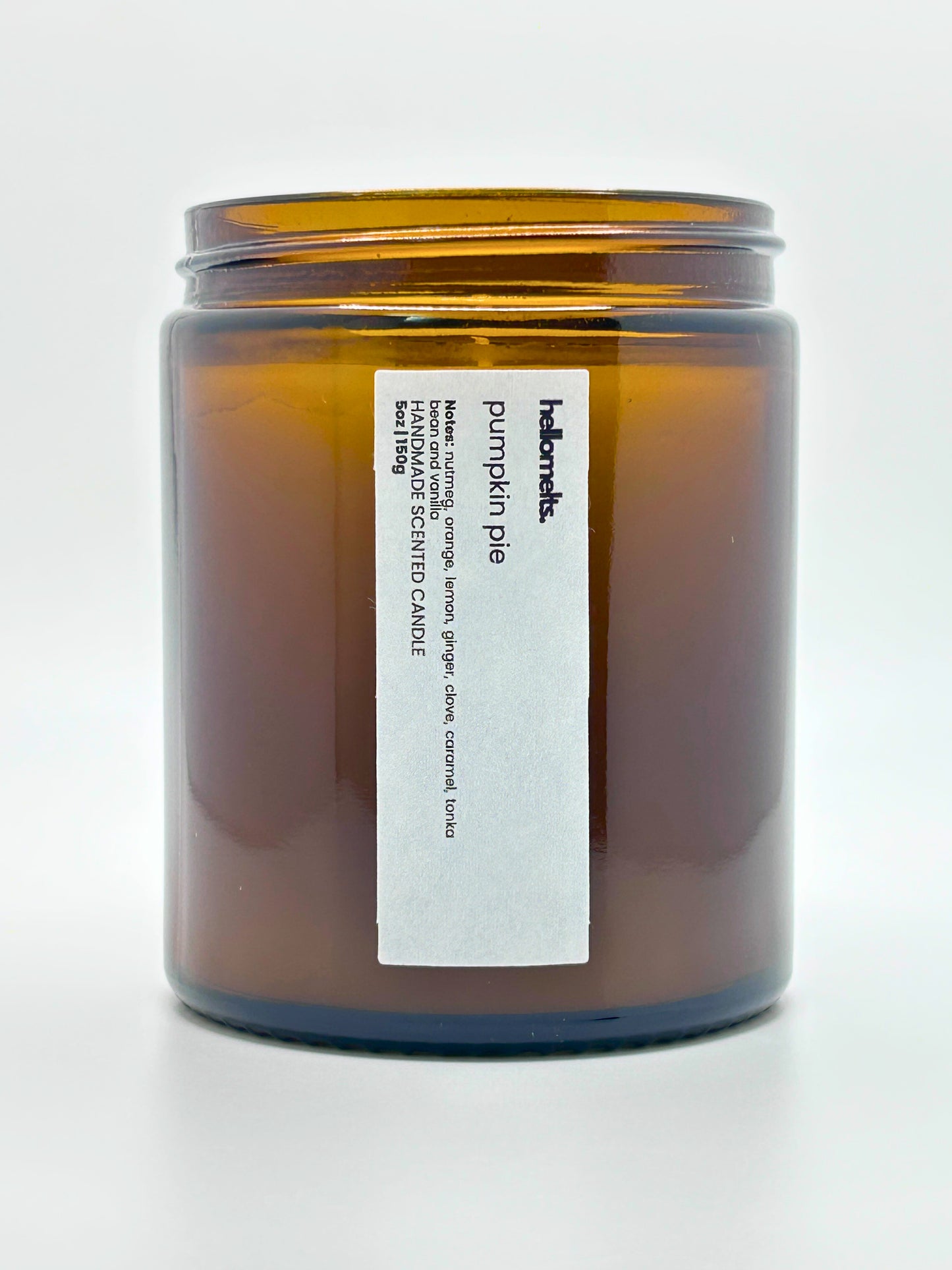 Close-up front view of Pumpkin Pie autumn scented candle by Hellomelts with the lid off, part of the Autumn Collection