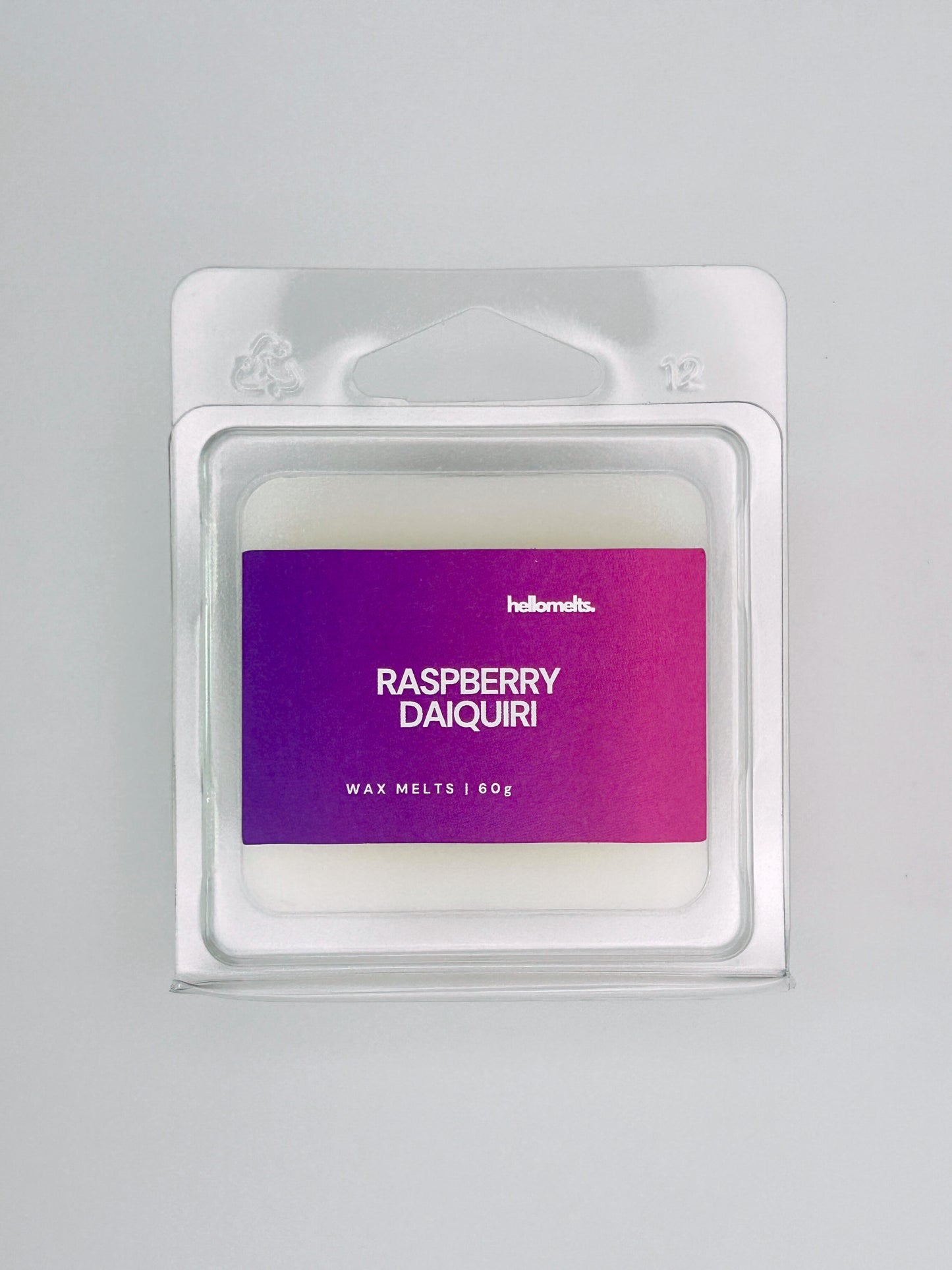 Close-up front view of Raspberry Daiquiri 60g wax melt bar by Hellomelts, showing wax texture and bold berry-toned label