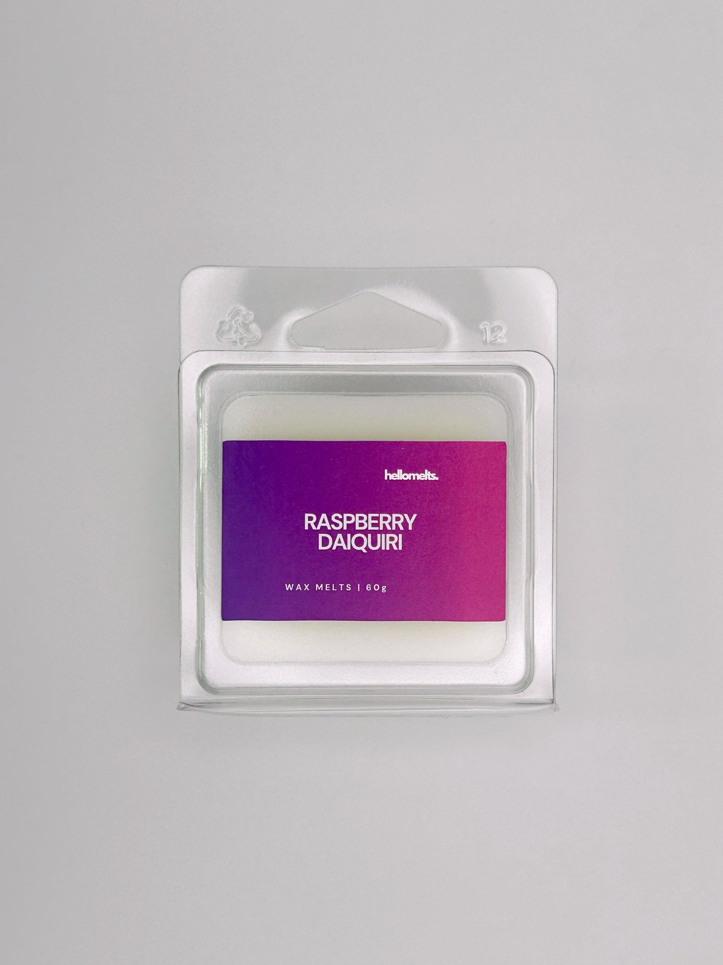 Flatlay of Raspberry Daiquiri 60g wax melt bar by Hellomelts, part of the Summer Collection with vibrant berry colours and summer design