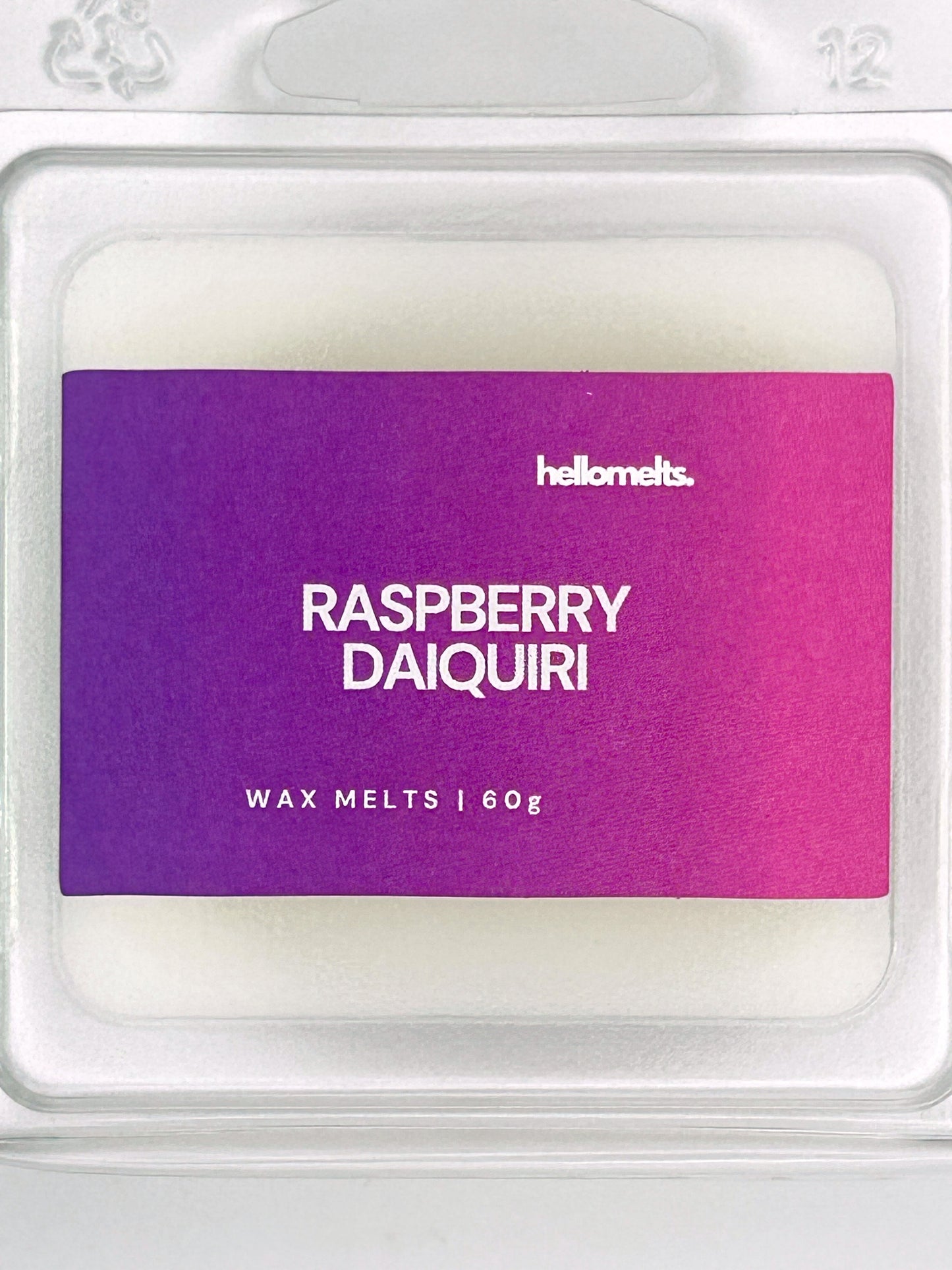Close-up of the Raspberry Daiquiri 60g wax melt label, showing detailed branding and cocktail-inspired scent design from Hellomelts