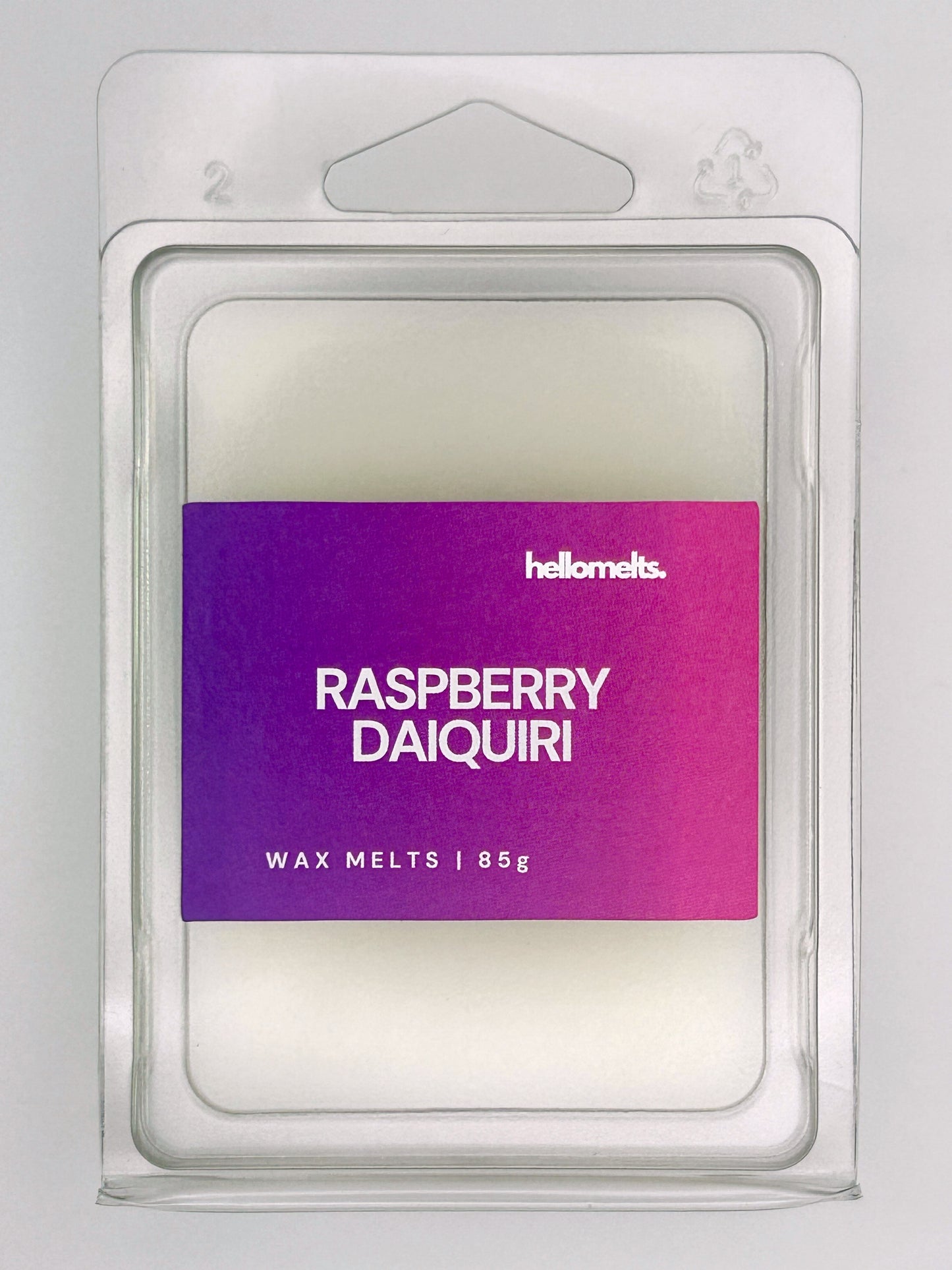 Close-up front view of Raspberry Daiquiri 85g wax melt bar by Hellomelts, showing wax texture and bold berry-toned label
