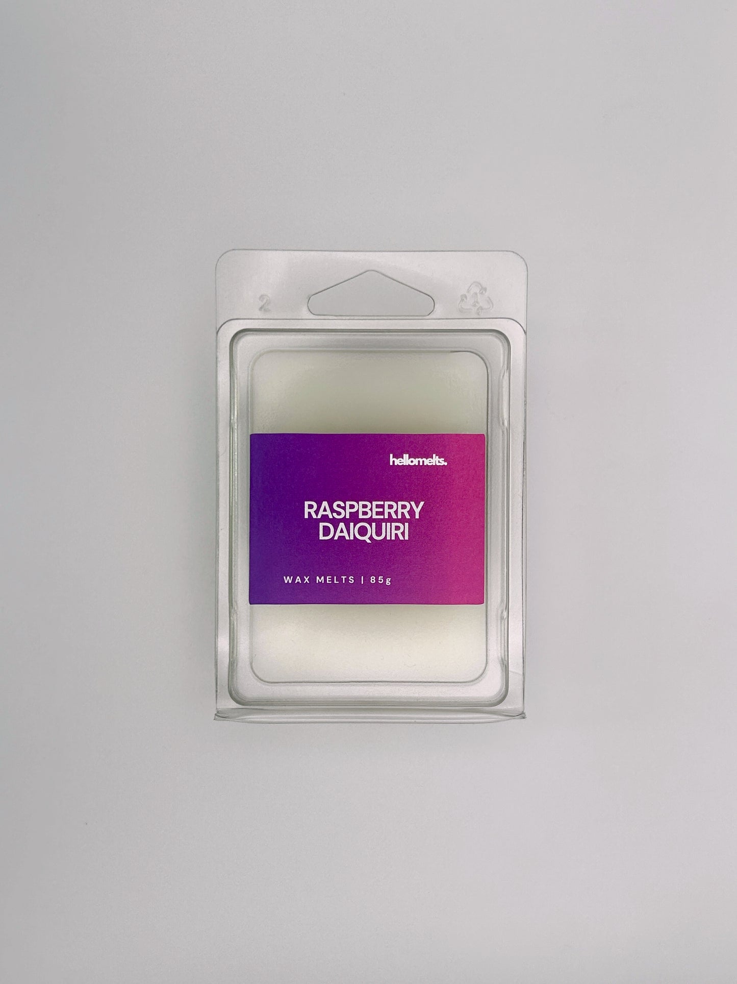 Flatlay of Raspberry Daiquiri 85g wax melt bar by Hellomelts, part of the Summer Collection with vibrant berry colours and summer design
