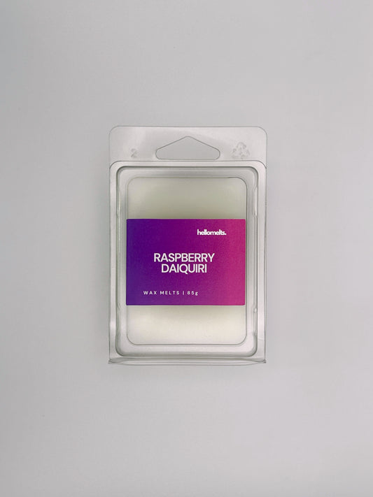 Flatlay of Raspberry Daiquiri 85g wax melt bar by Hellomelts, part of the Summer Collection with vibrant berry colours and summer design