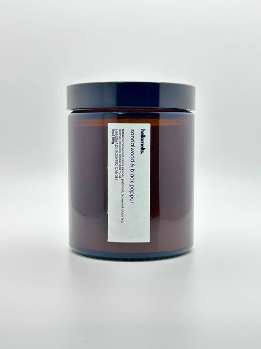 Front view of Sandalwood & Black Pepper autumn candle by Hellomelts with the lid on, part of the Autumn Collection