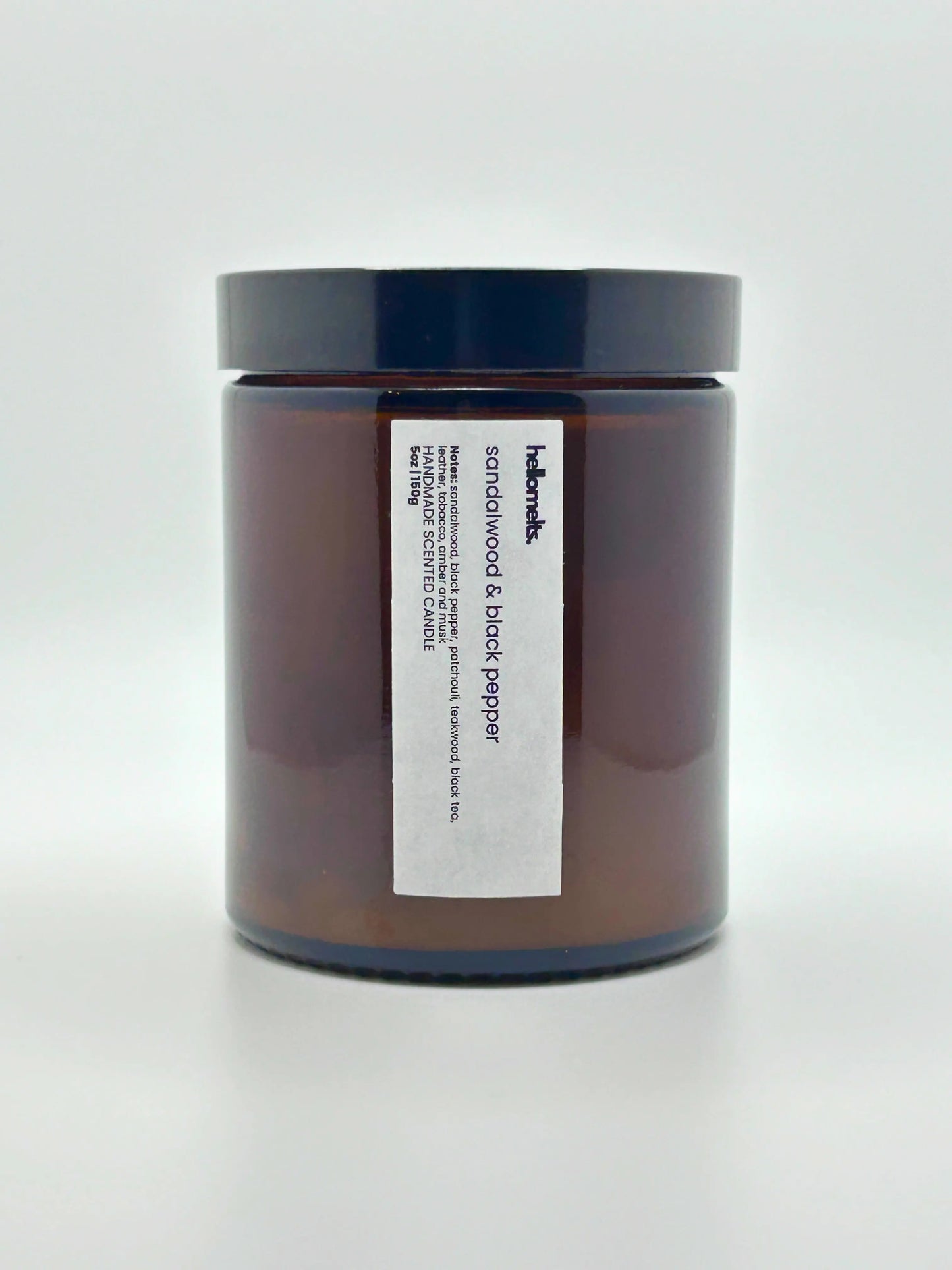 Front view of Sandalwood & Black Pepper scented candle by Hellomelts with the lid on, part of the autumn collection.