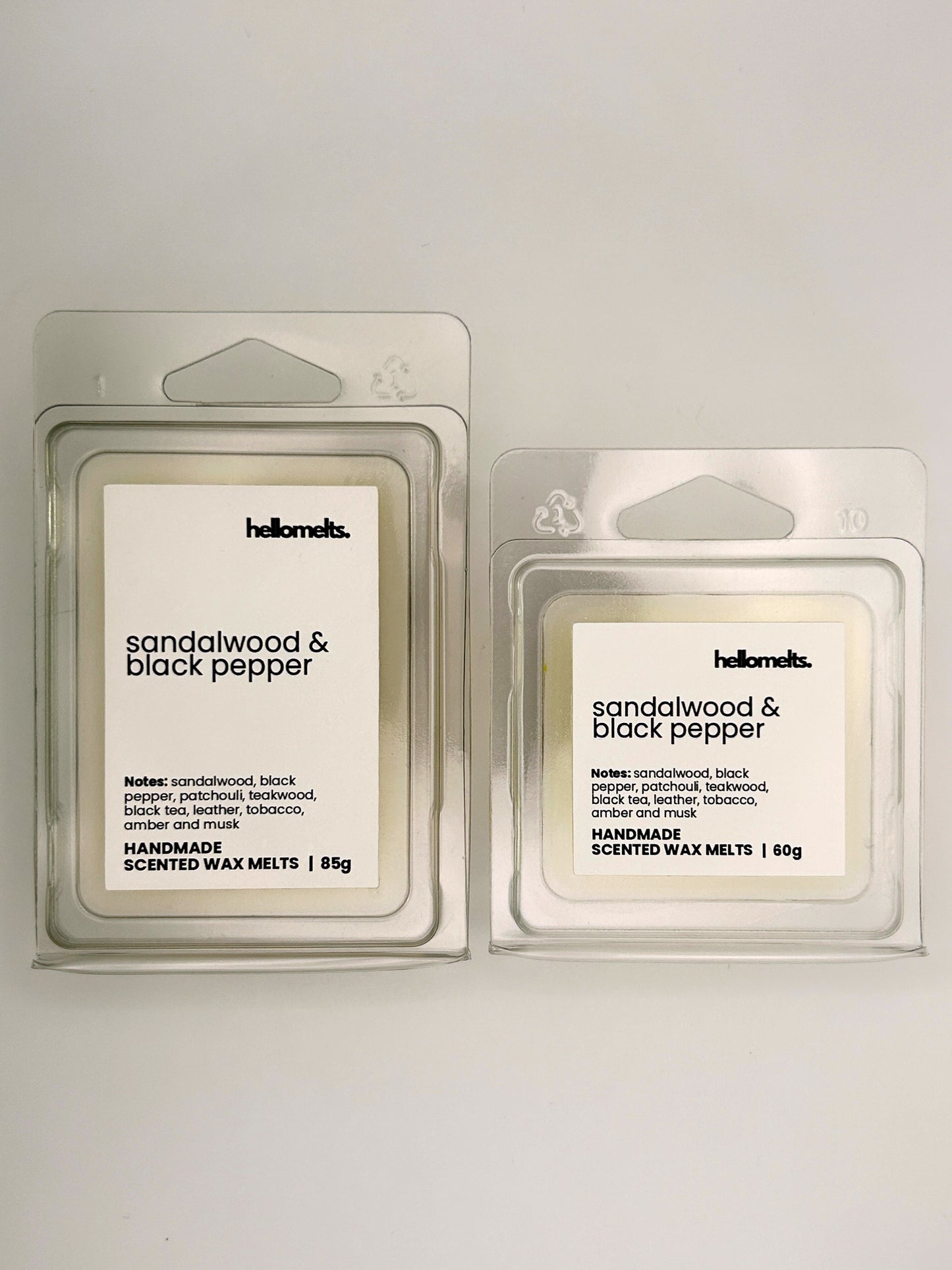 Sandalwood & Black Pepper wax melts in 60g and 85g clamshells shown side by side from the Hellomelts Autumn Collection