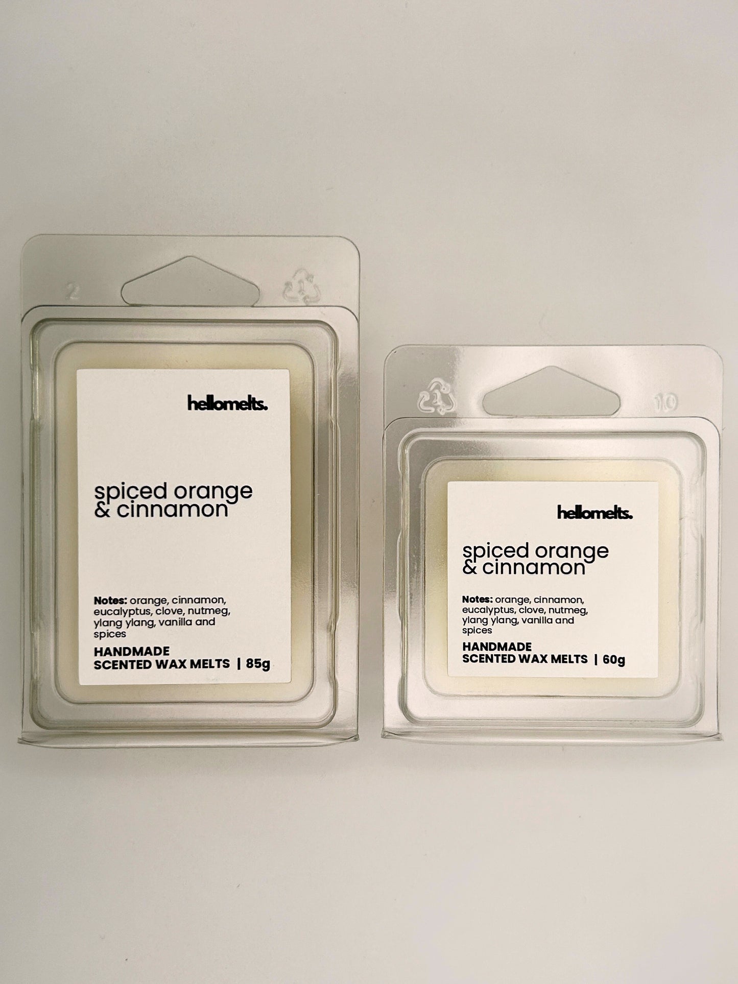 Spiced Orange & Cinnamon wax melts in 60g and 85g clamshells shown side by side from the Hellomelts Autumn Collection