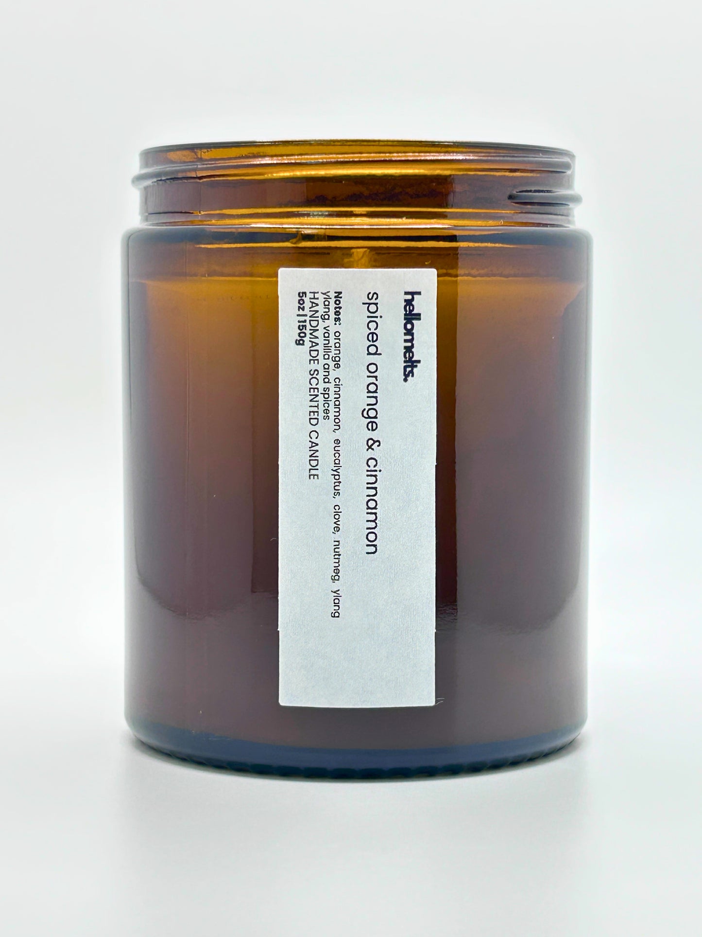 Close-up front view of Spiced Orange & Cinnamon autumn scented candle by Hellomelts with the lid off, part of the Autumn Collection