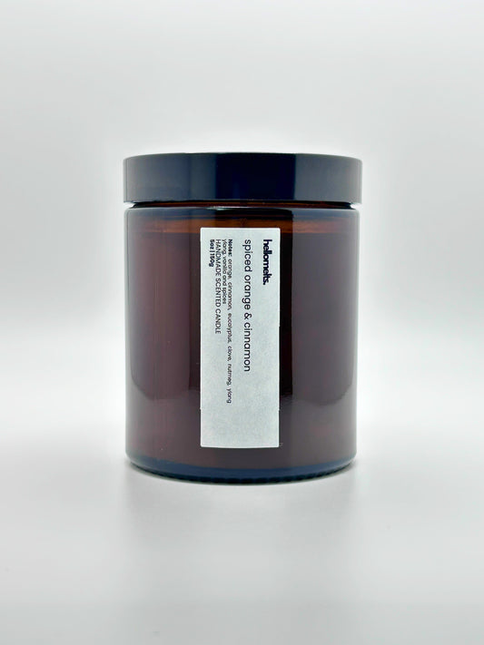 Front view of Spiced Orange & Cinnamon autumn candle by Hellomelts with the lid on, part of the Autumn Collection