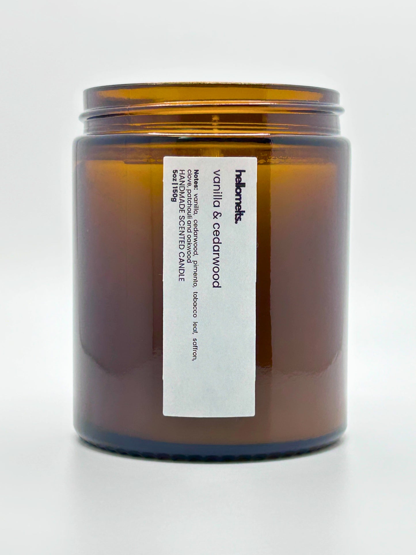 Close-up front view of Vanilla & Cedarwood autumn scented candle by Hellomelts with the lid off, part of the Autumn Collection