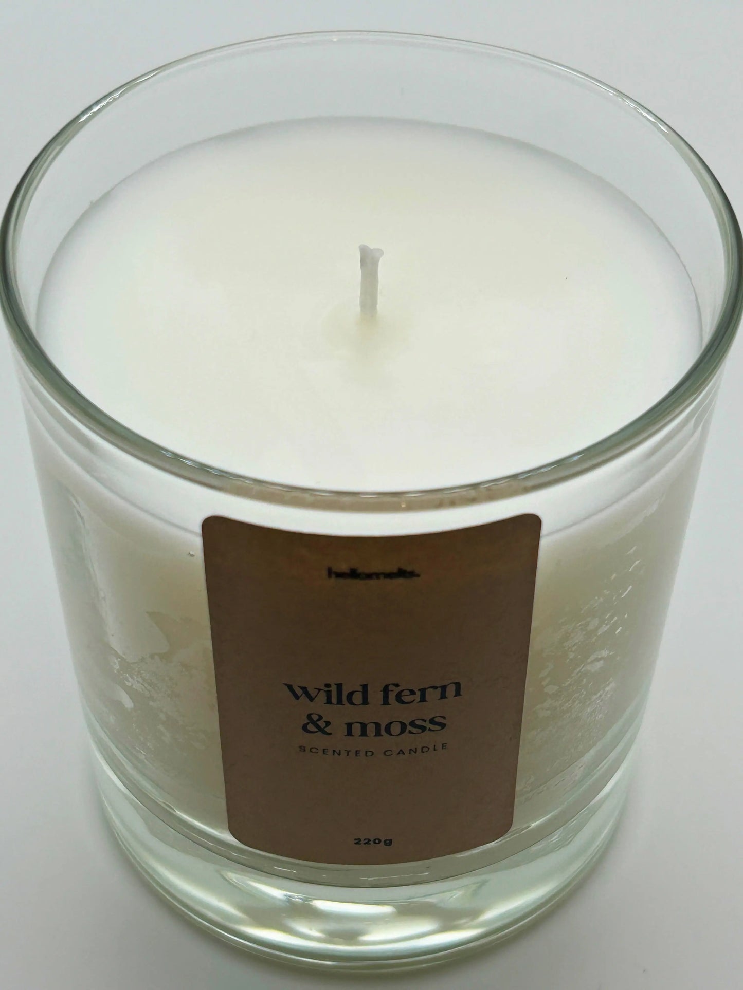 Close-up detail of the Wild Fern & Moss candle wax and wick, highlighting the clean white wax used in Hellomelts' Spring Collection.