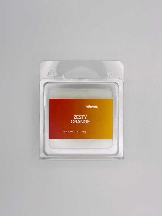 Flatlay of Zesty Orange 60g wax melt bar by Hellomelts, part of the Summer Collection with vibrant orange tones and clean design