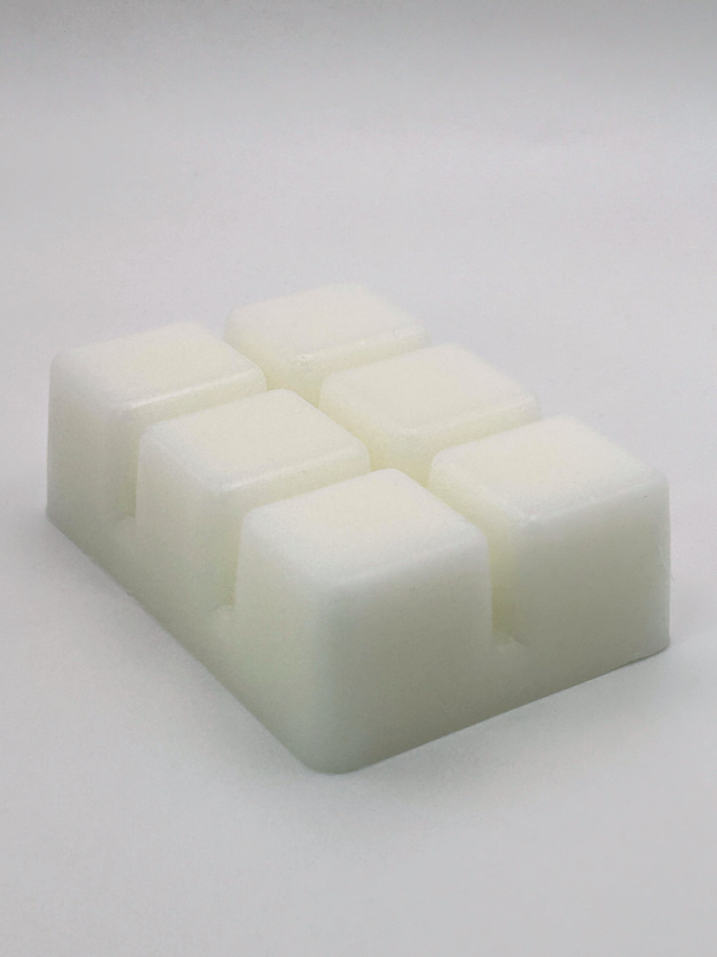 Angled view of Zesty Orange 85g wax melt bar by Hellomelts, highlighting 6 cubed bar design