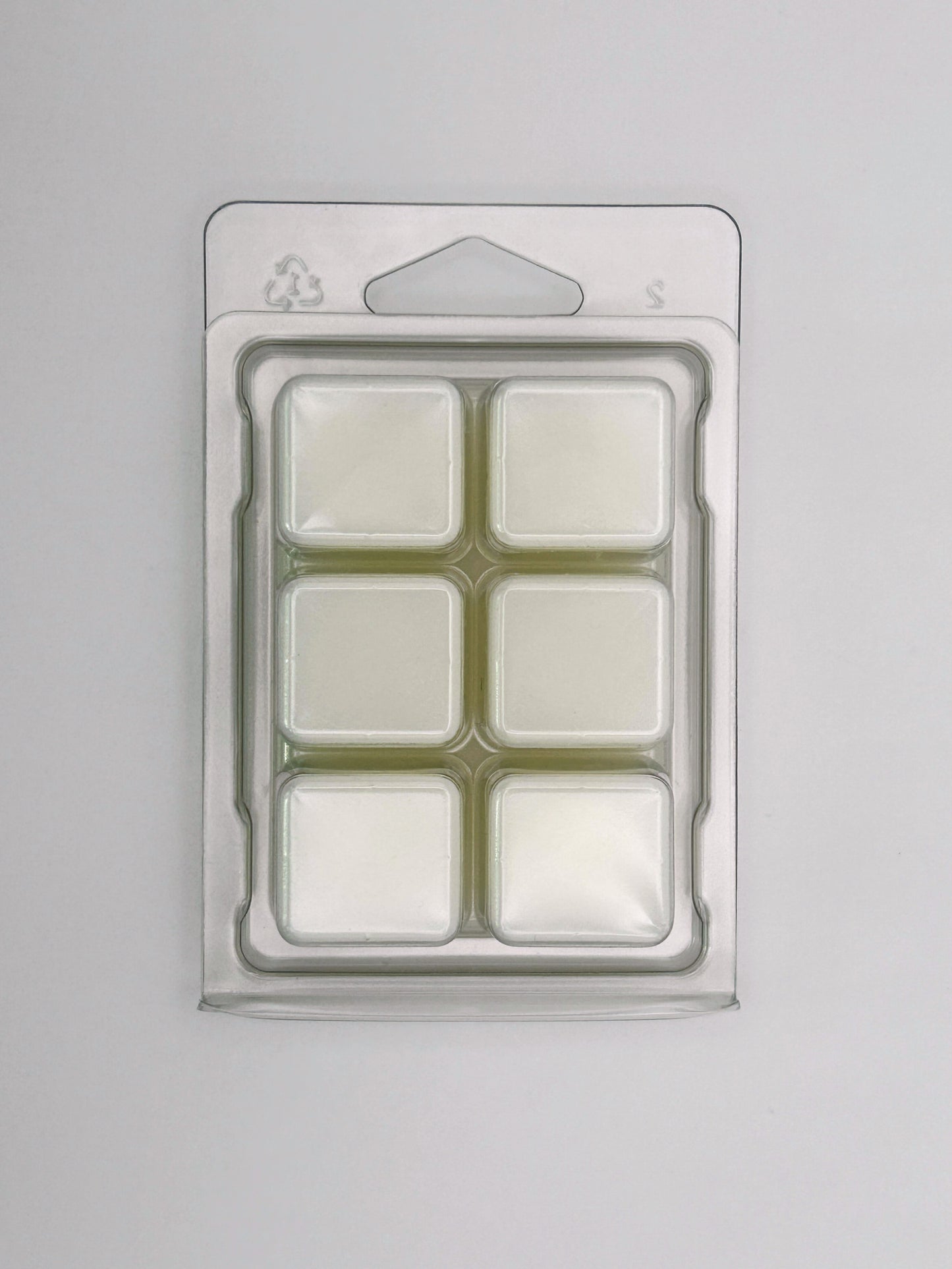 Back view of the Zesty Orange 85g wax melt packaging, showing cubed bar design