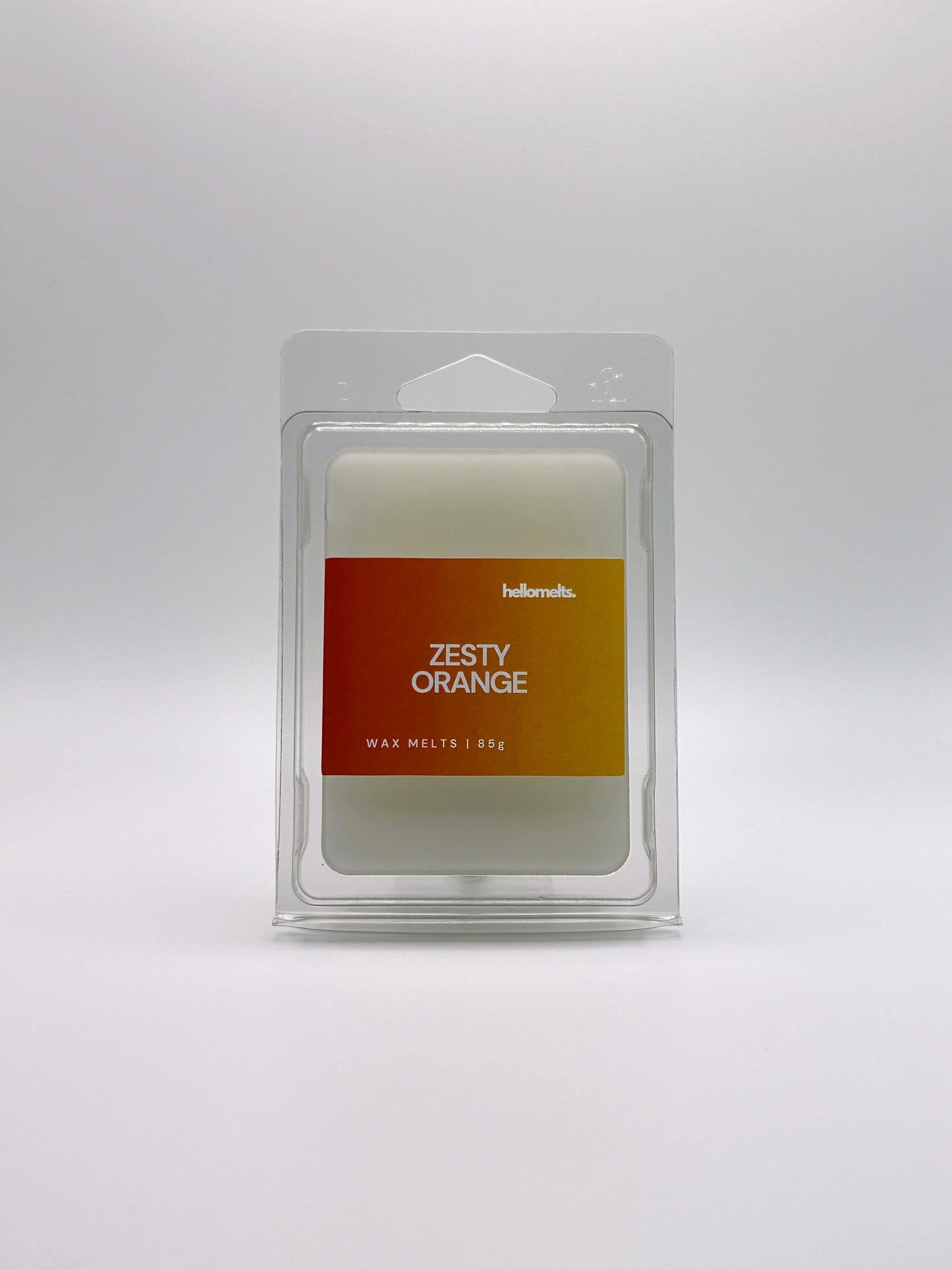 Front-facing view of Hellomelts Zesty Orange 85g wax melt bar from the Summer Collection, featuring bright citrus-themed packaging