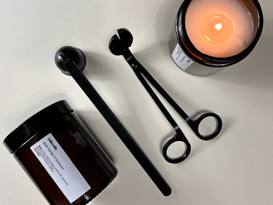 Lit Hellomelts candle with candle care tools for a home fragrance guide on choosing the best candle scent for each room