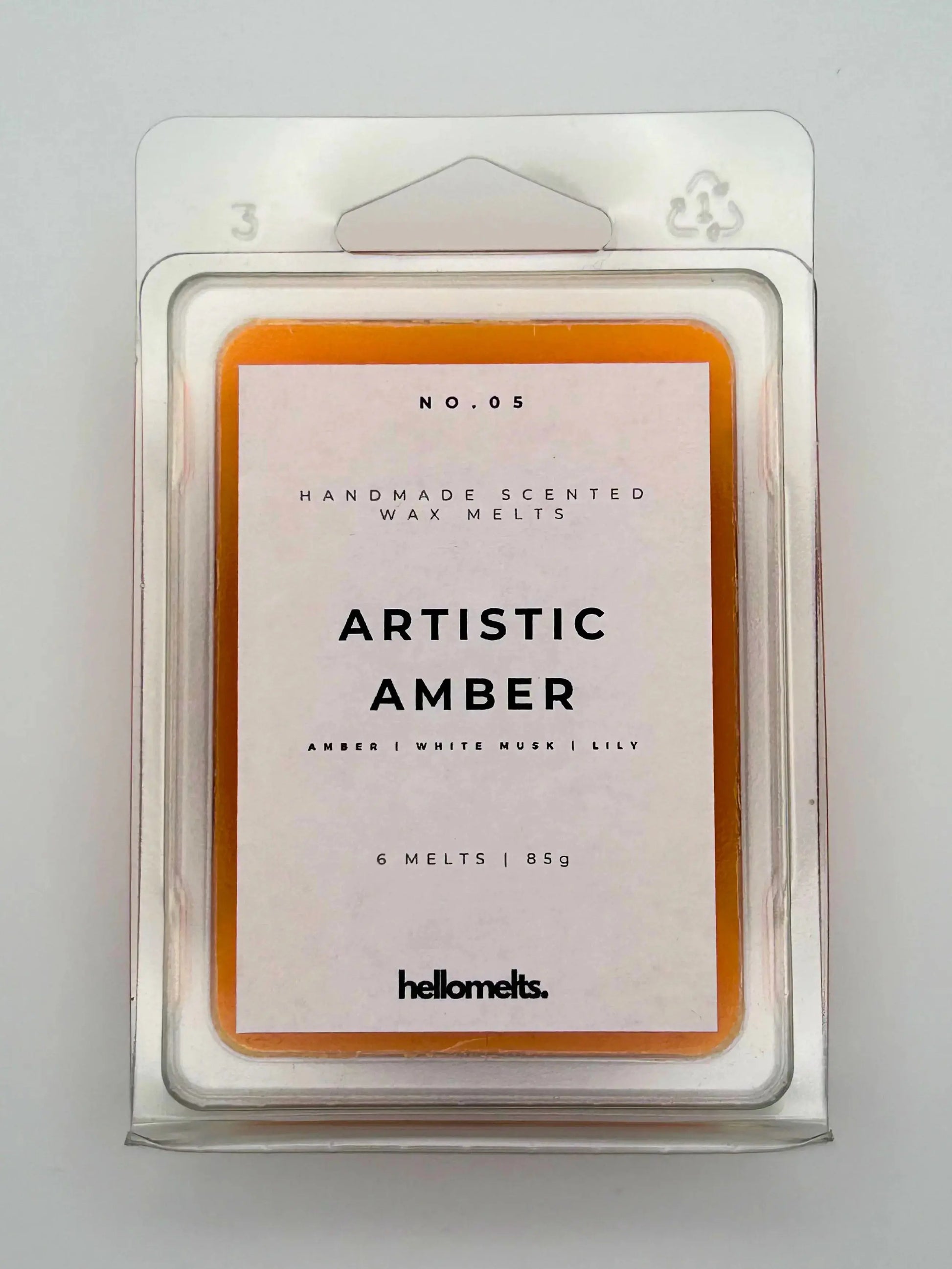 Artistic Amber 85g wax melt pack, front view, by Hellomelts, infused with notes of amber, white musk, and lily, ready to fragrance your home.