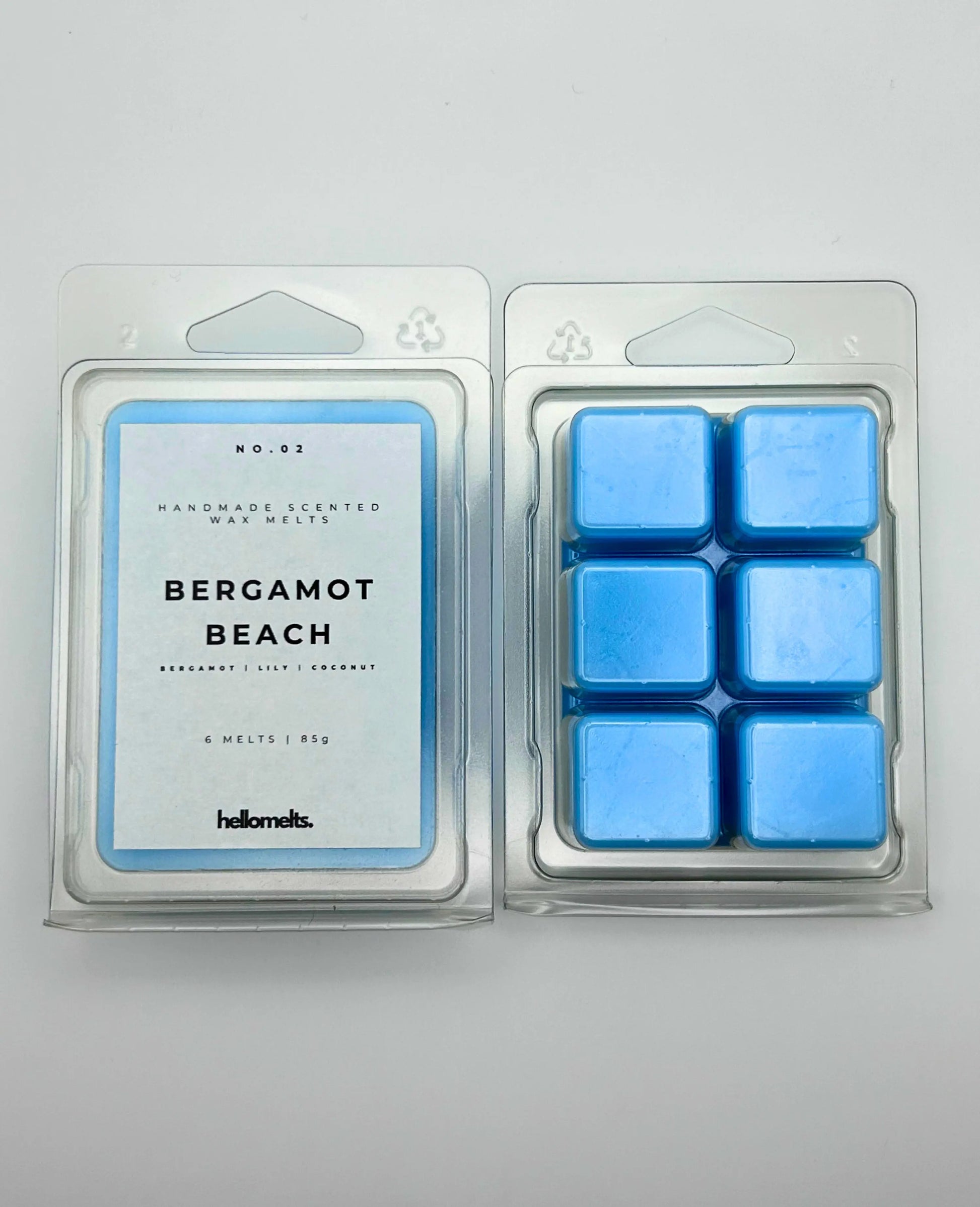 Bergamot Beach 85g wax melt pack, by Hellomelts, showcasing the front and back with bergamot, lily, and coconut notes, ready to evoke a seaside escape.