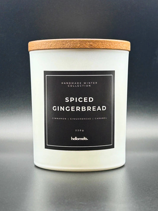 Spiced Gingerbread 220g candle, with lid on, by Hellomelts, rich with scents of cinnamon, gingerbread, and caramel, presented in a white matt jar with wooden lid.