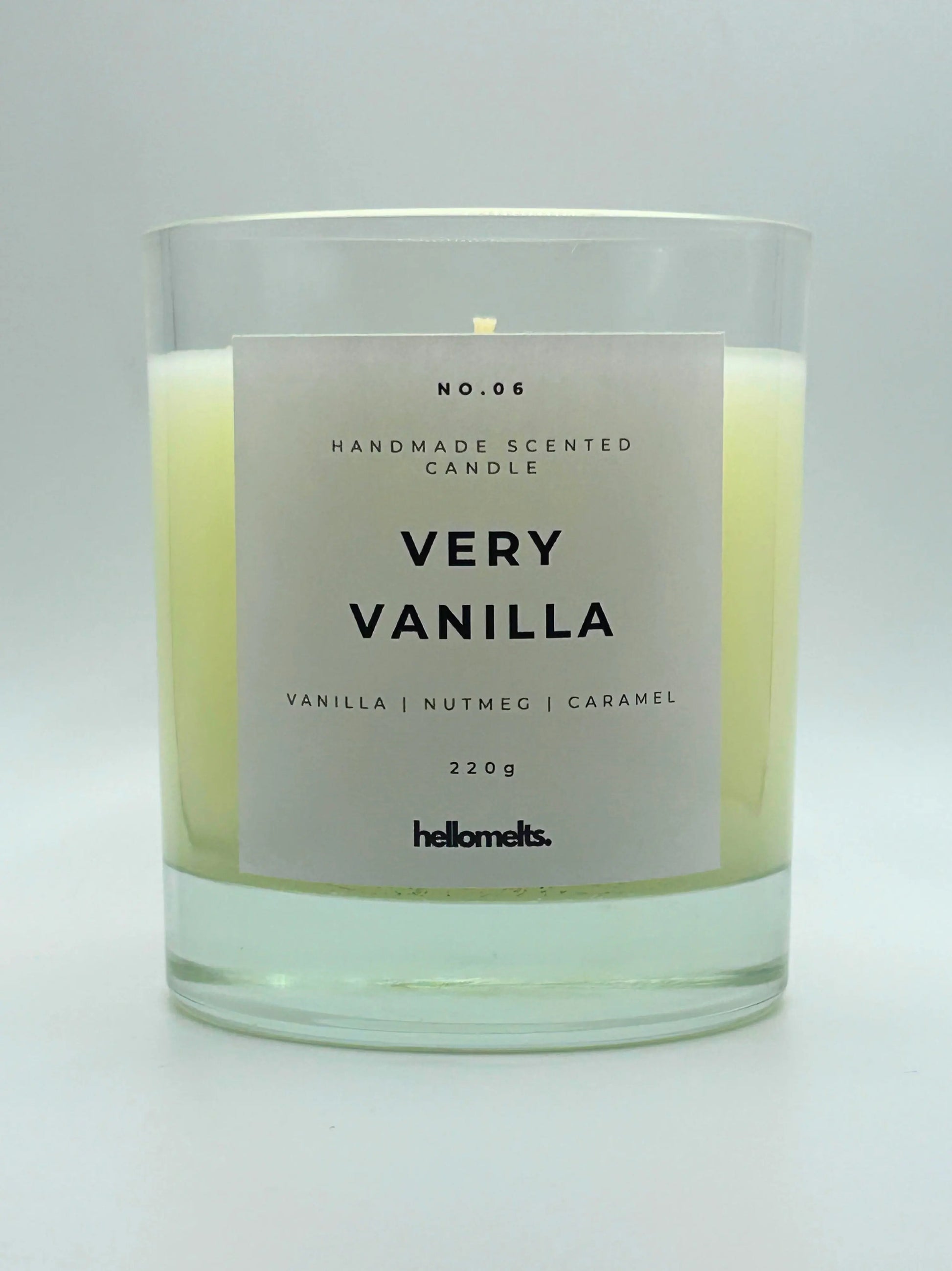 Very Vanilla 220g candle by Hellomelts, with no lid, infused with the warm scents of vanilla, nutmeg, and caramel, showcased in a simple white wax.
