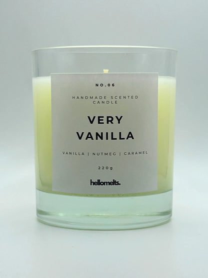 Very Vanilla 220g candle by Hellomelts, with no lid, infused with the warm scents of vanilla, nutmeg, and caramel, showcased in a simple white wax.