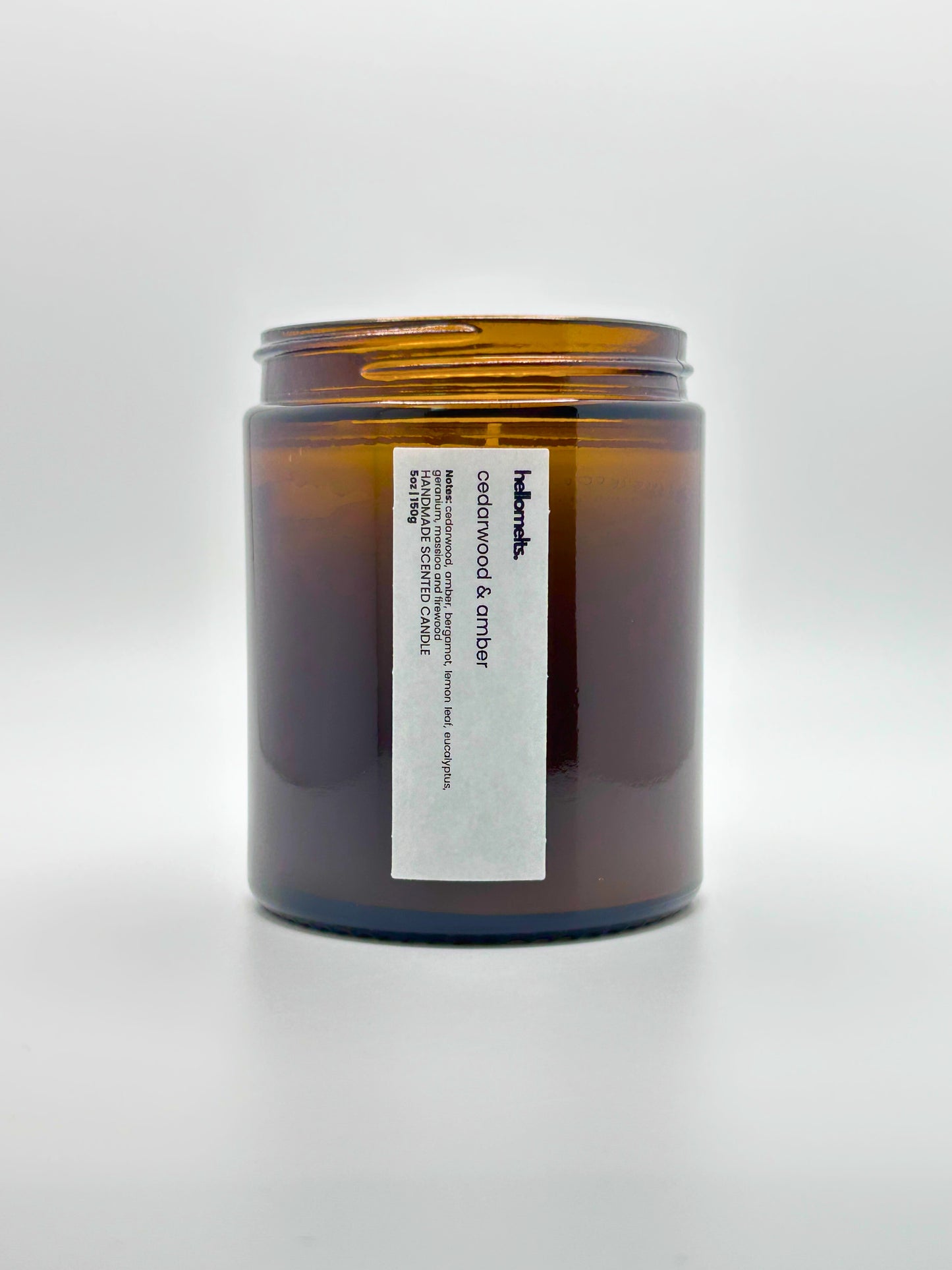 Front view of Cedarwood &  Amber autumn scented candle by Hellomelts with the lid off, part of the Autumn Collection