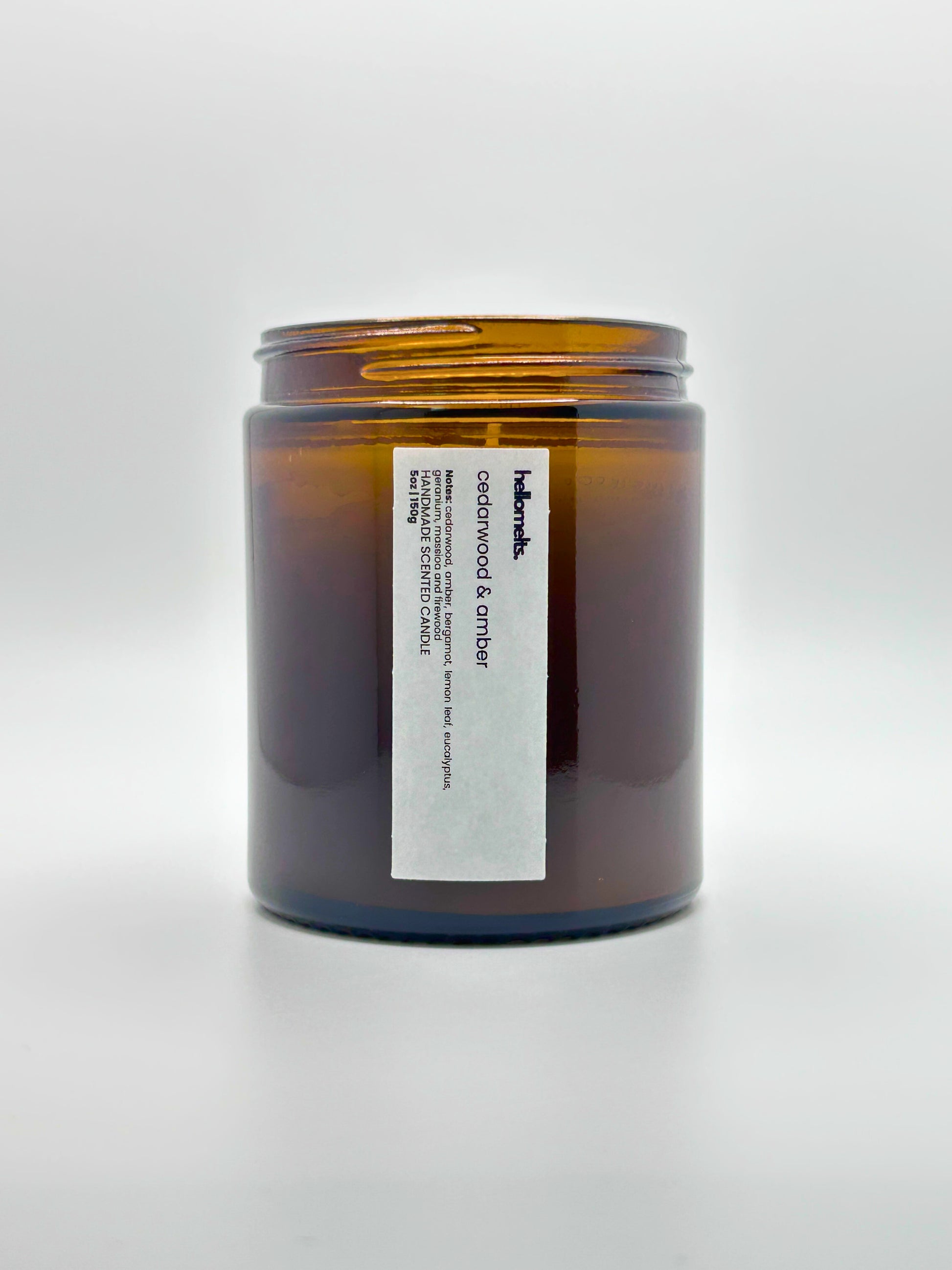 Front view of Cedarwood &  Amber autumn scented candle by Hellomelts with the lid off, part of the Autumn Collection