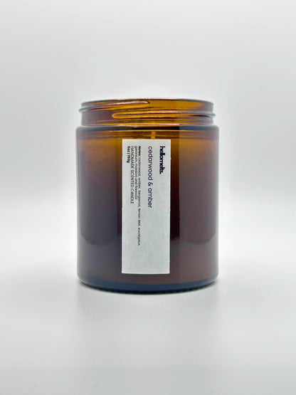 Front view of Cedarwood &  Amber autumn scented candle by Hellomelts with the lid off, part of the Autumn Collection