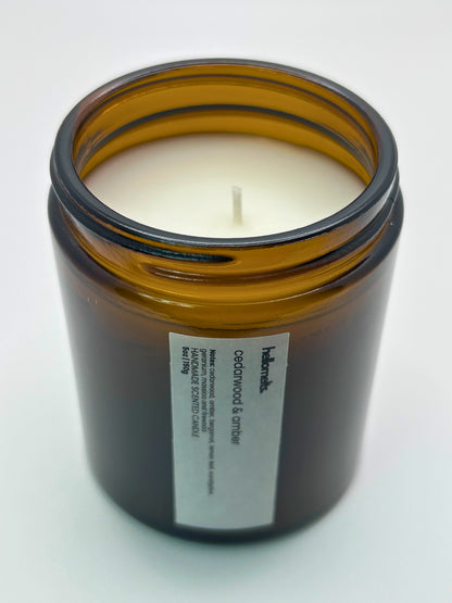 Angled top-down view of Cedarwood &  Amber autumn candle by Hellomelts, highlighting the wick and hand-poured wax, part of the Autumn Collection