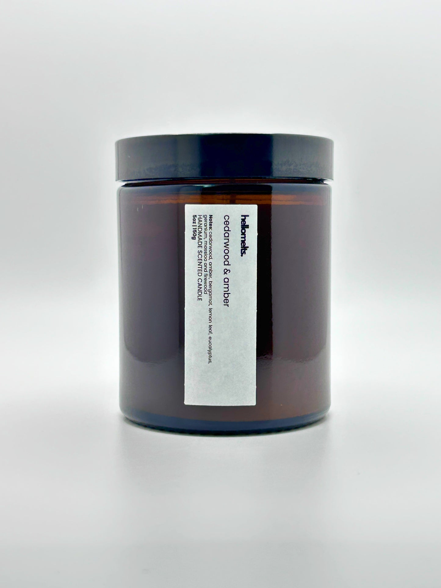 Front view of Cedarwood &  Amber autumn candle by Hellomelts with the lid on, part of the Autumn Collection